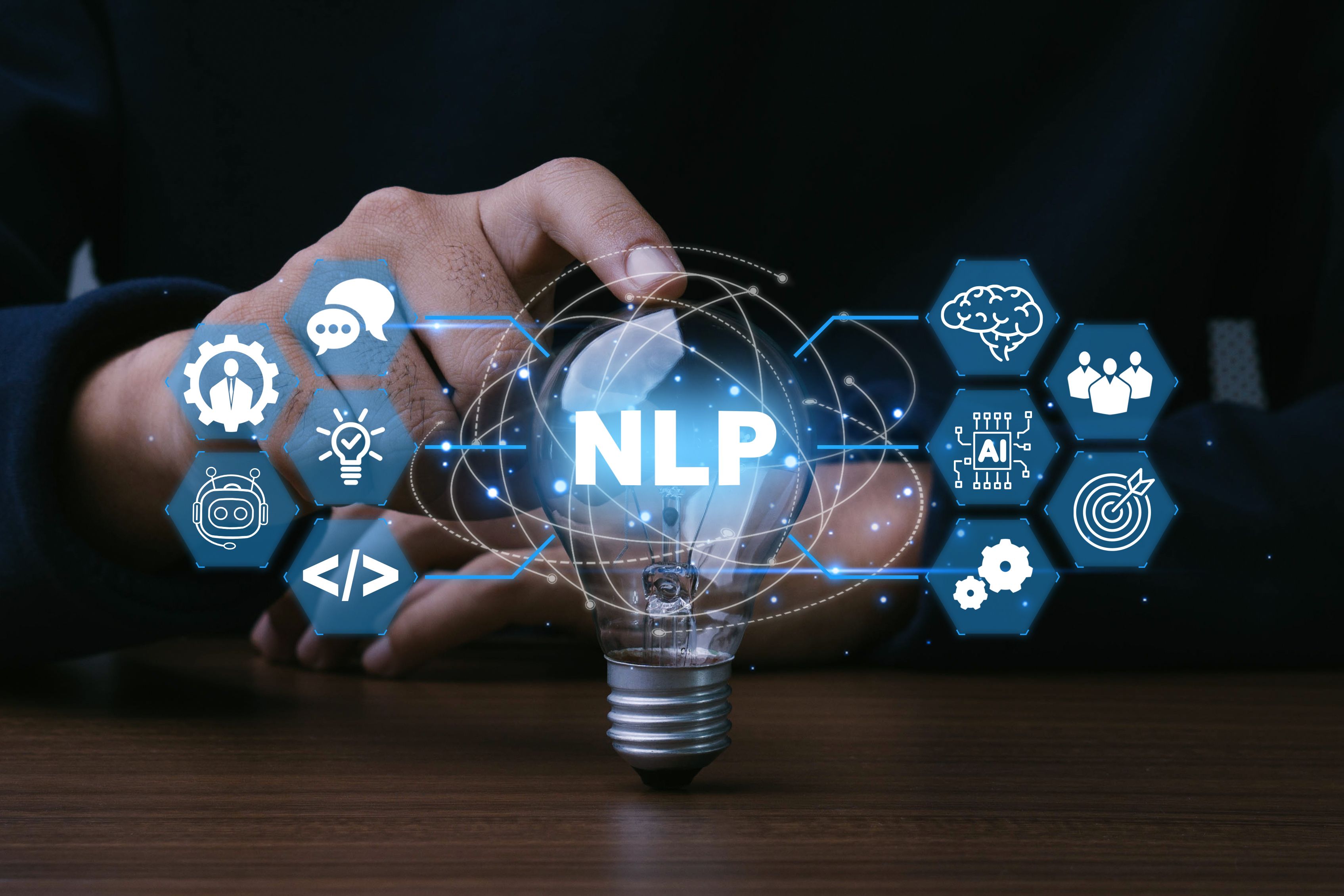 Businessman hand touch light bulb with NLP - Neuro linguistic programming concept. AI, Chat bot, software and data analysis tools. Businessman hand touch light bulb with NLP - Neuro linguistic programming concept. AI, Chat bot, software and data analysis tools.