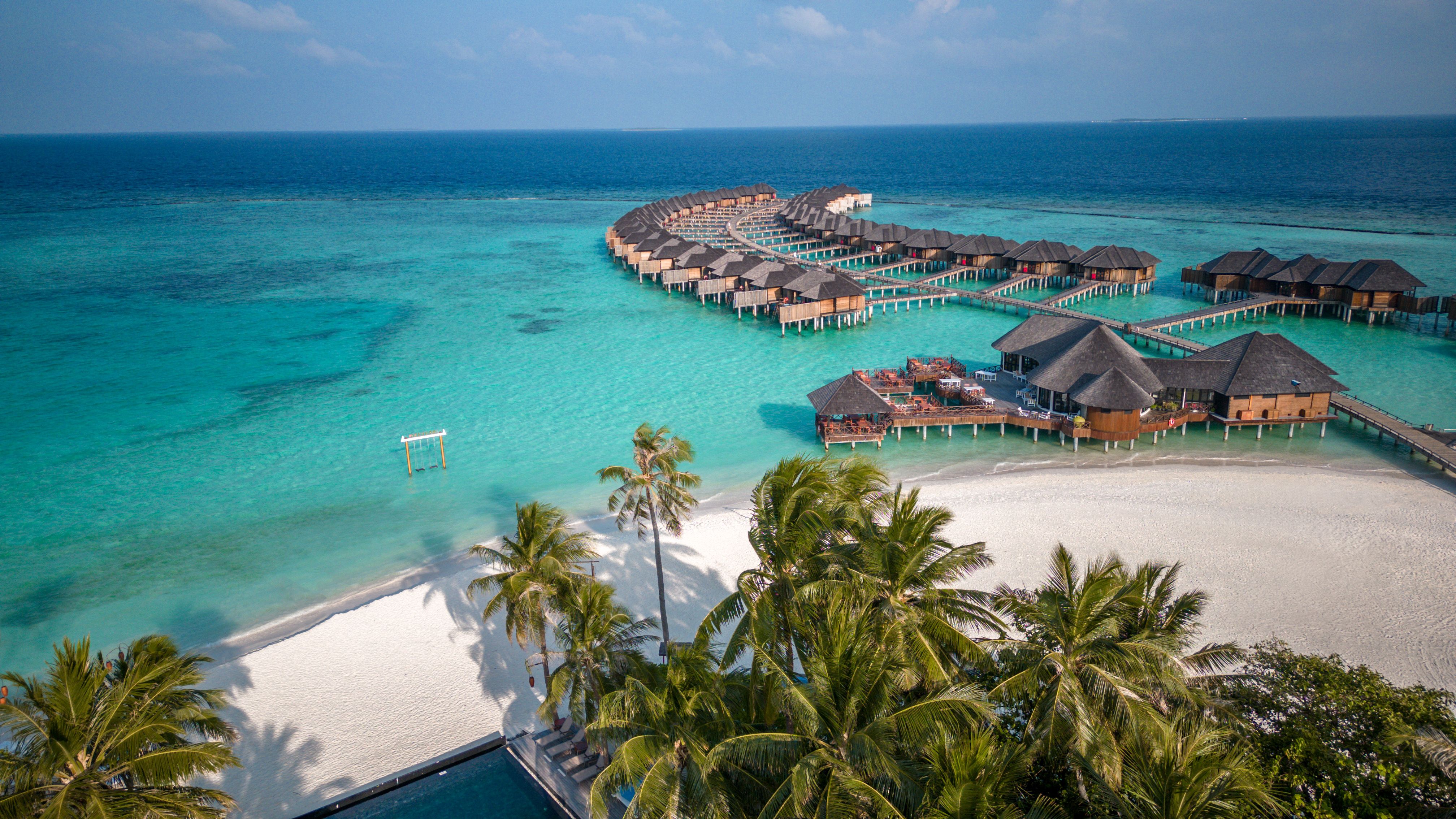 Maldives hotel beach resort on tropical Island with aerial drone view Maldives hotel beach resort on tropical Island with aerial drone view