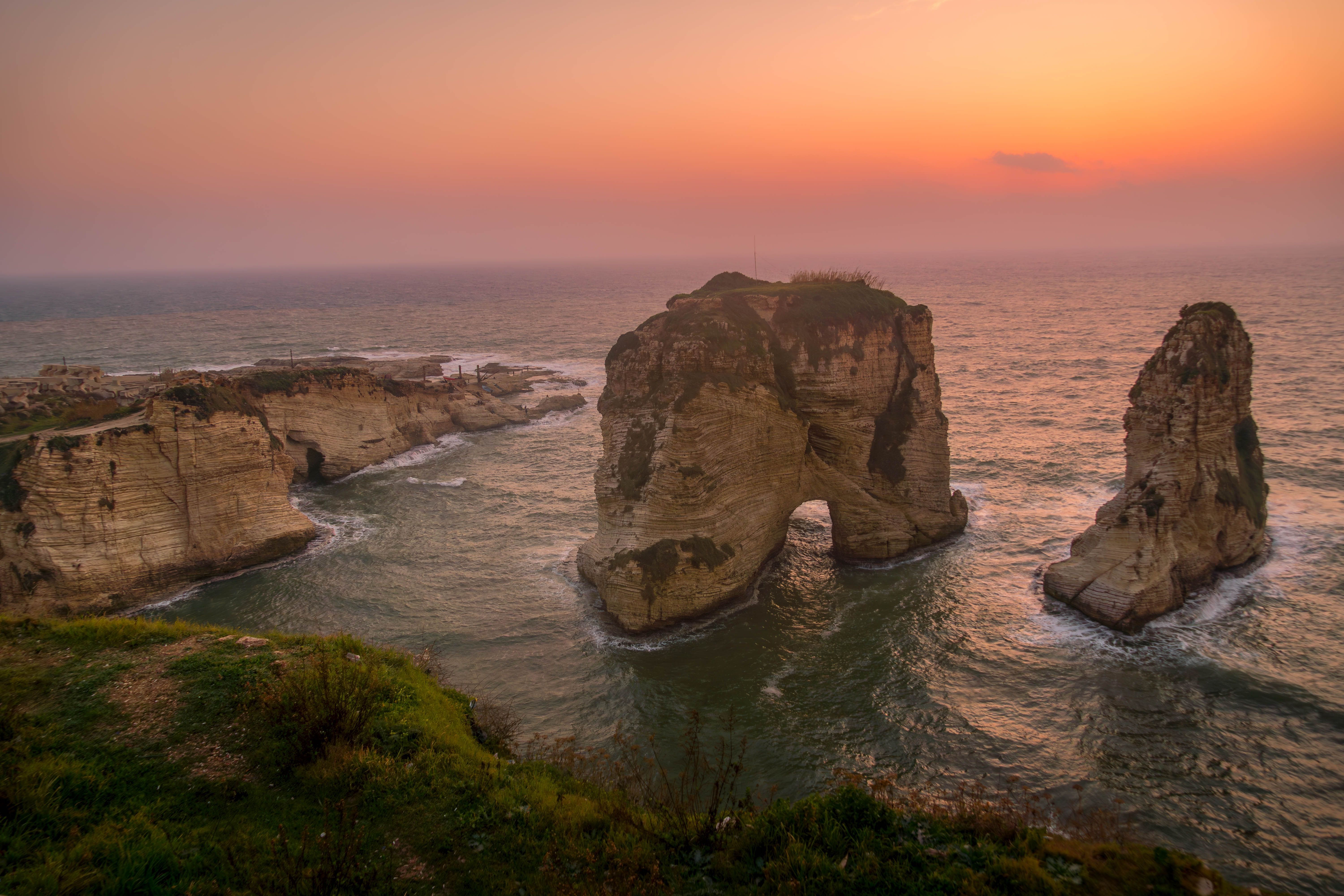 The scenic view of Pigeons' Rock (Raouche rocks), Beirut landmark on the Mediterranean sea coast, during the beautiful sunset