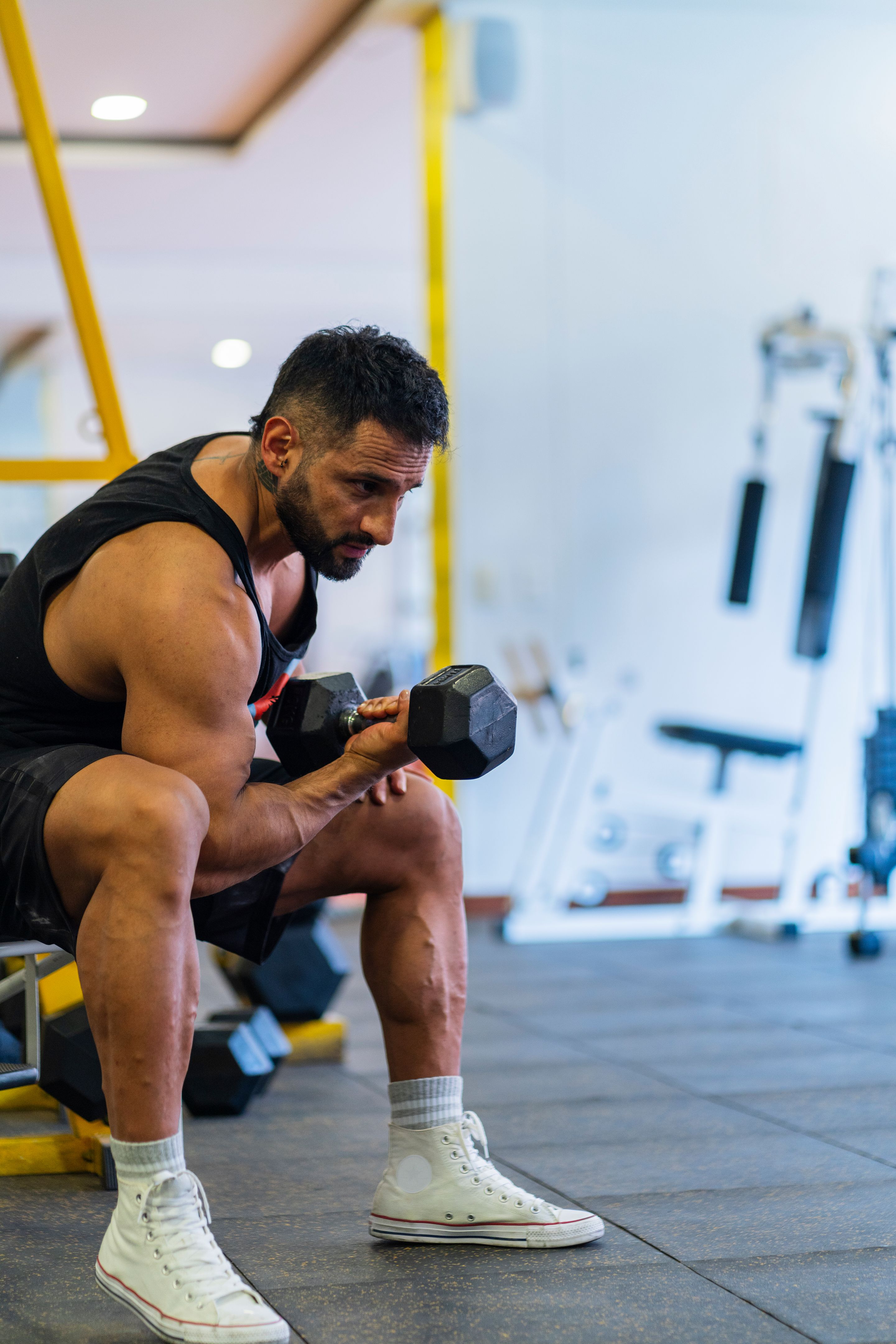 Athlete trains in the gym while alone Athlete trains in the gym while alone
