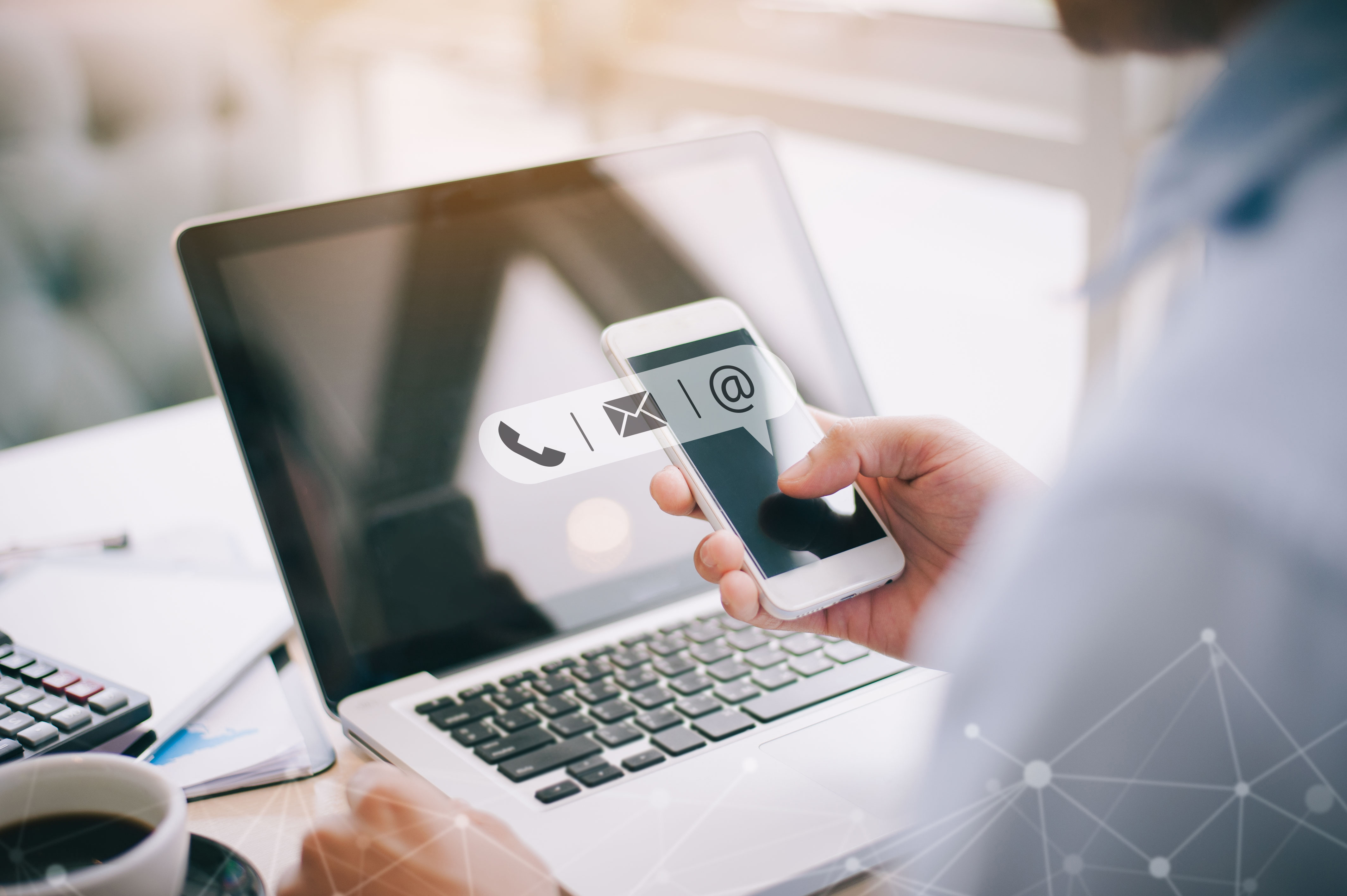 Hand of Businessman holding mobile smartphone with ( mail,phone,email ) icon. customer support concept, copy space