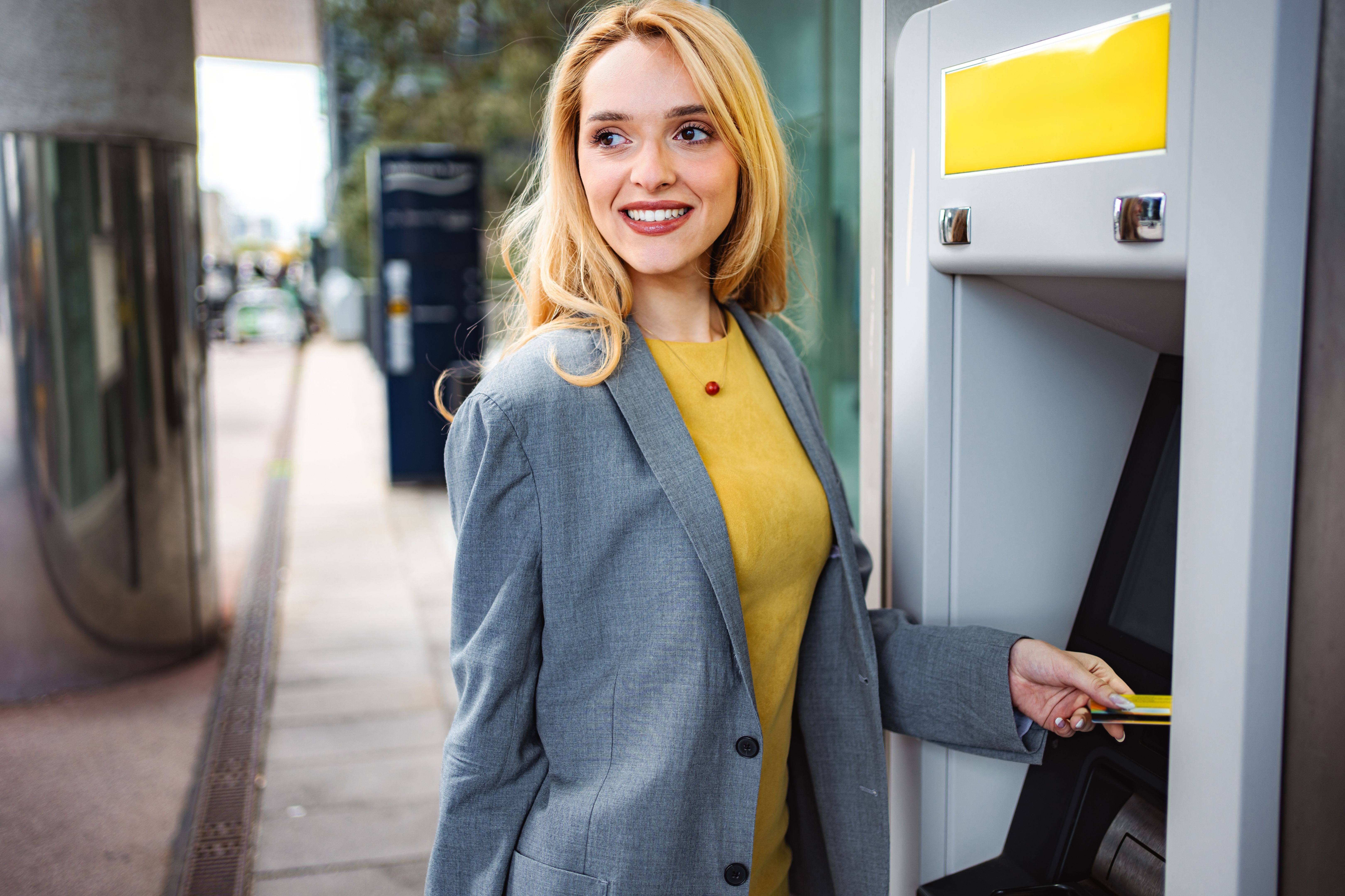 happy customer using atm