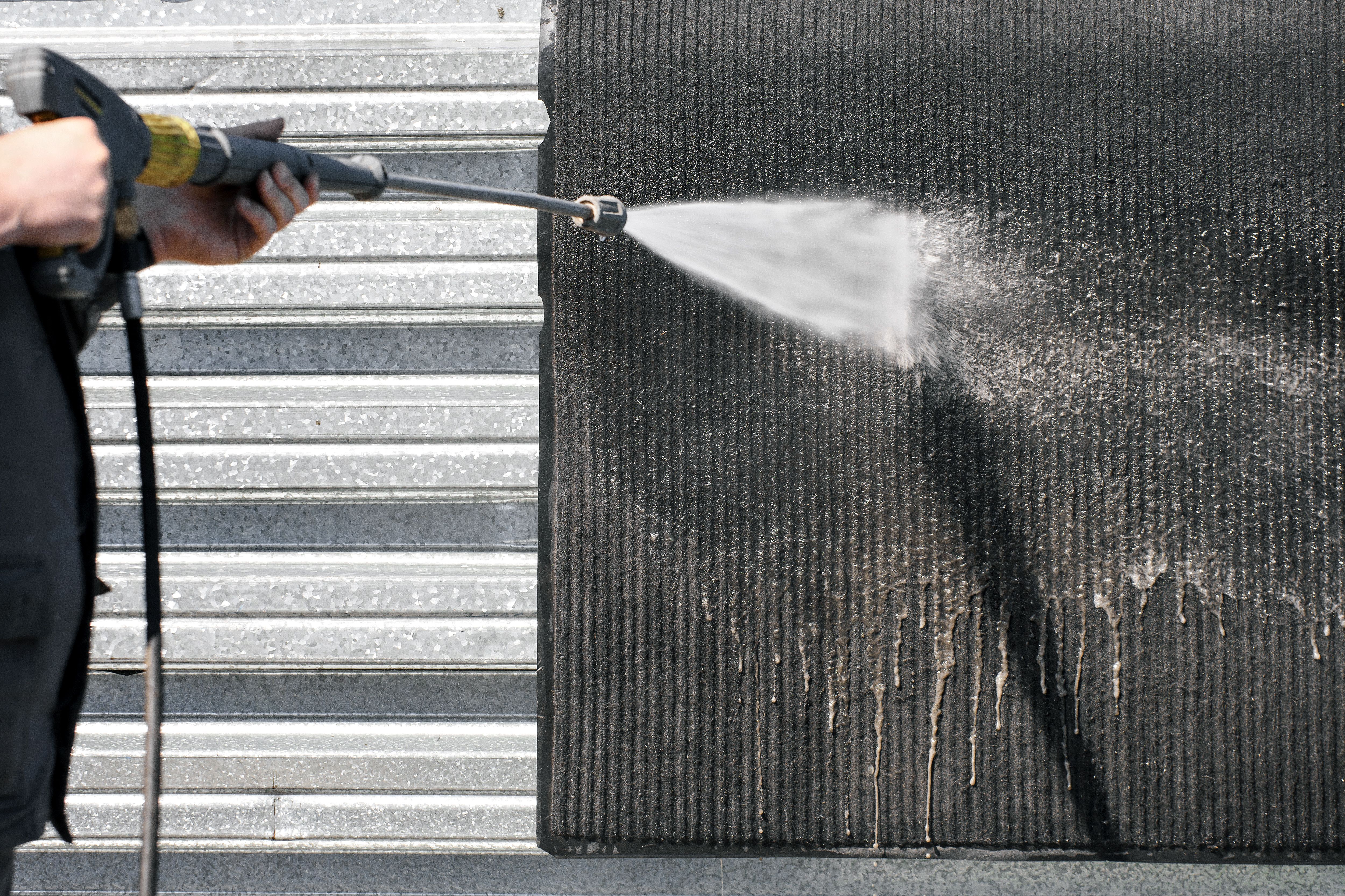 cleaning outdoor mat
