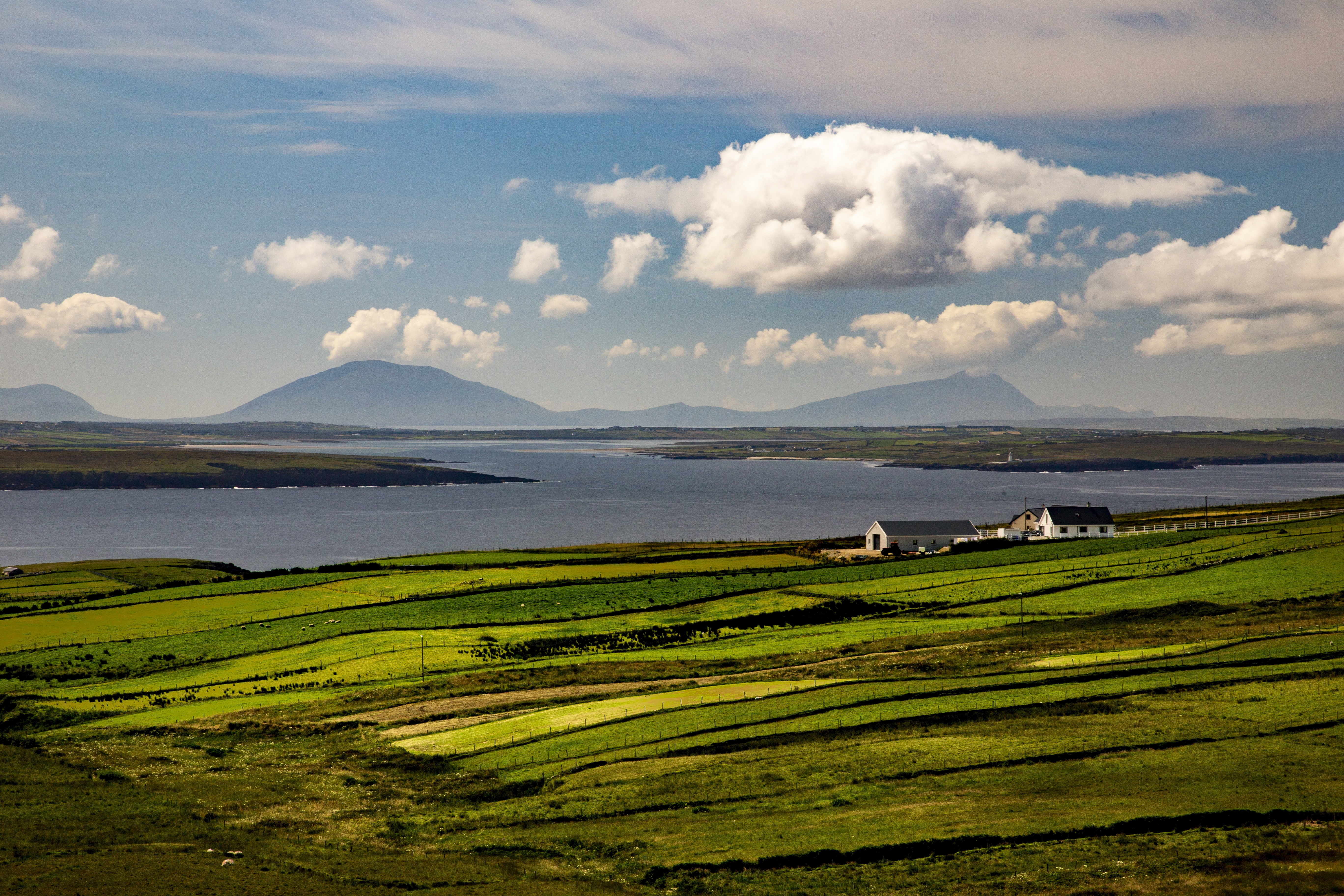 High angle shot of a valley next to the sea in the Near Ballycastle of the County Mayo in Ireland High angle shot of a valley next to the sea in the Near Ballycastle of the County Mayo in Ireland