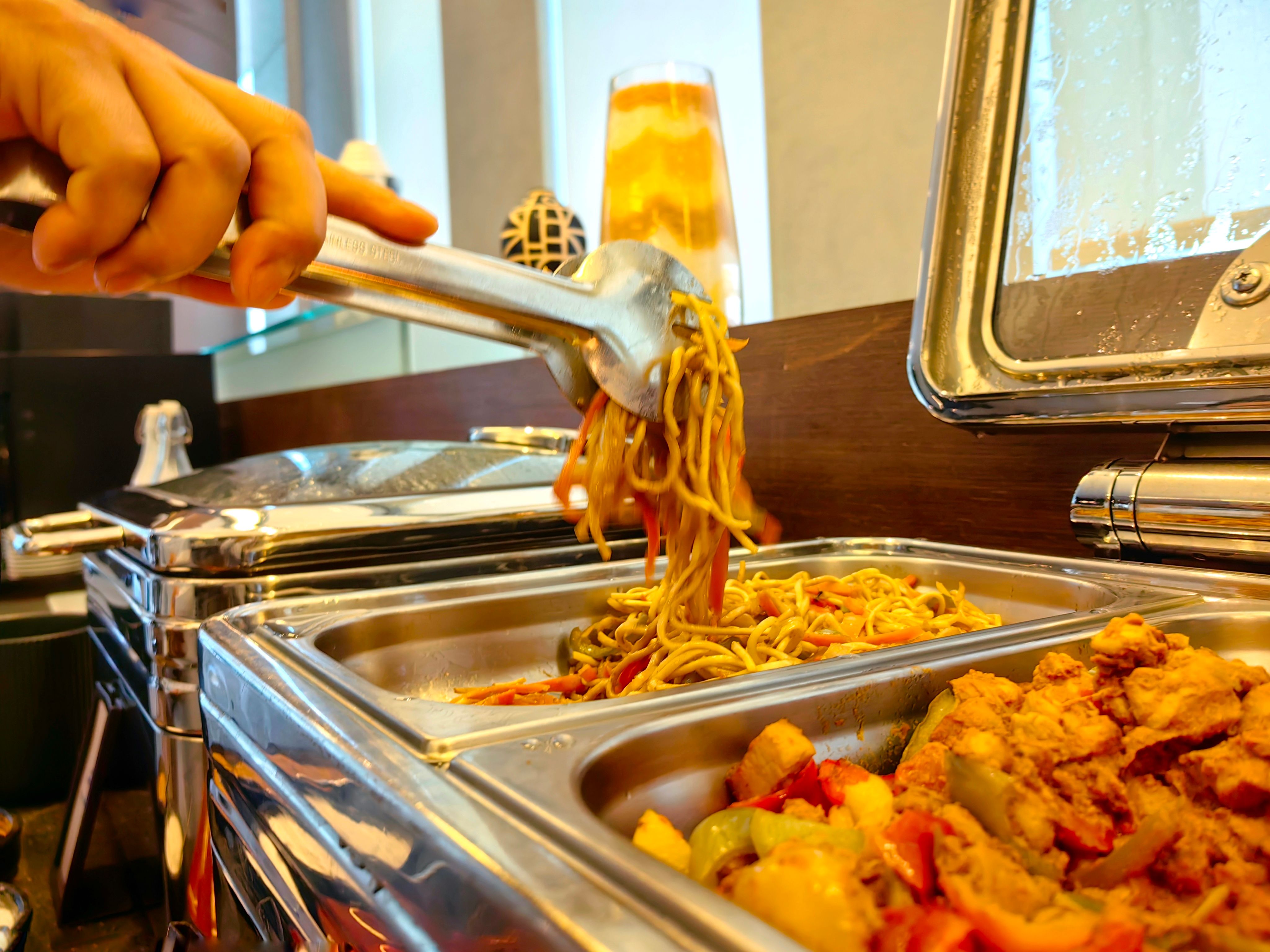 grab delicious fried noodle from buffet. grab delicious fried noodle from buffet.