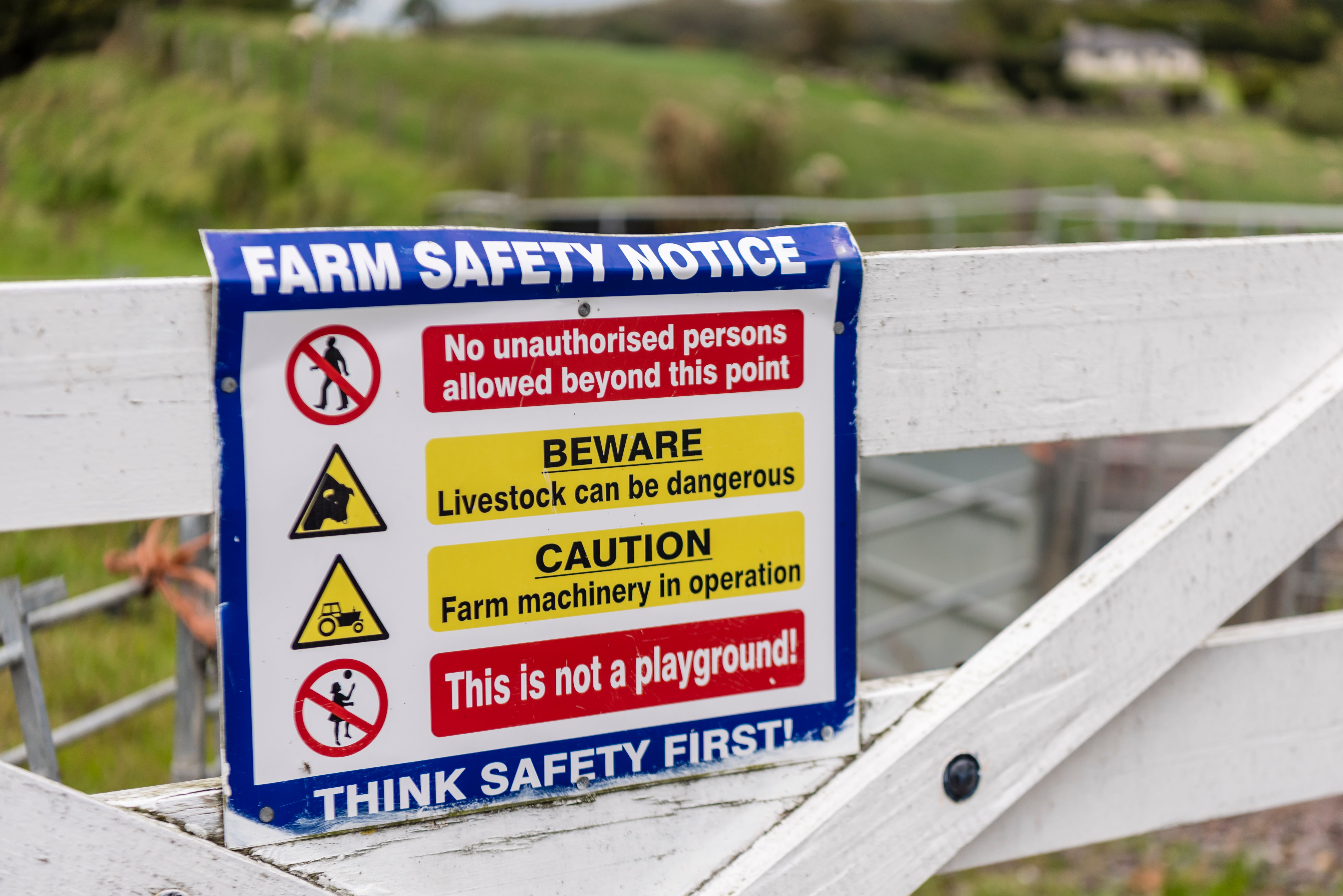 Sign on a field gate warning people not to enter farmland due to danger to life from livestock, and risk of bio-security breech.