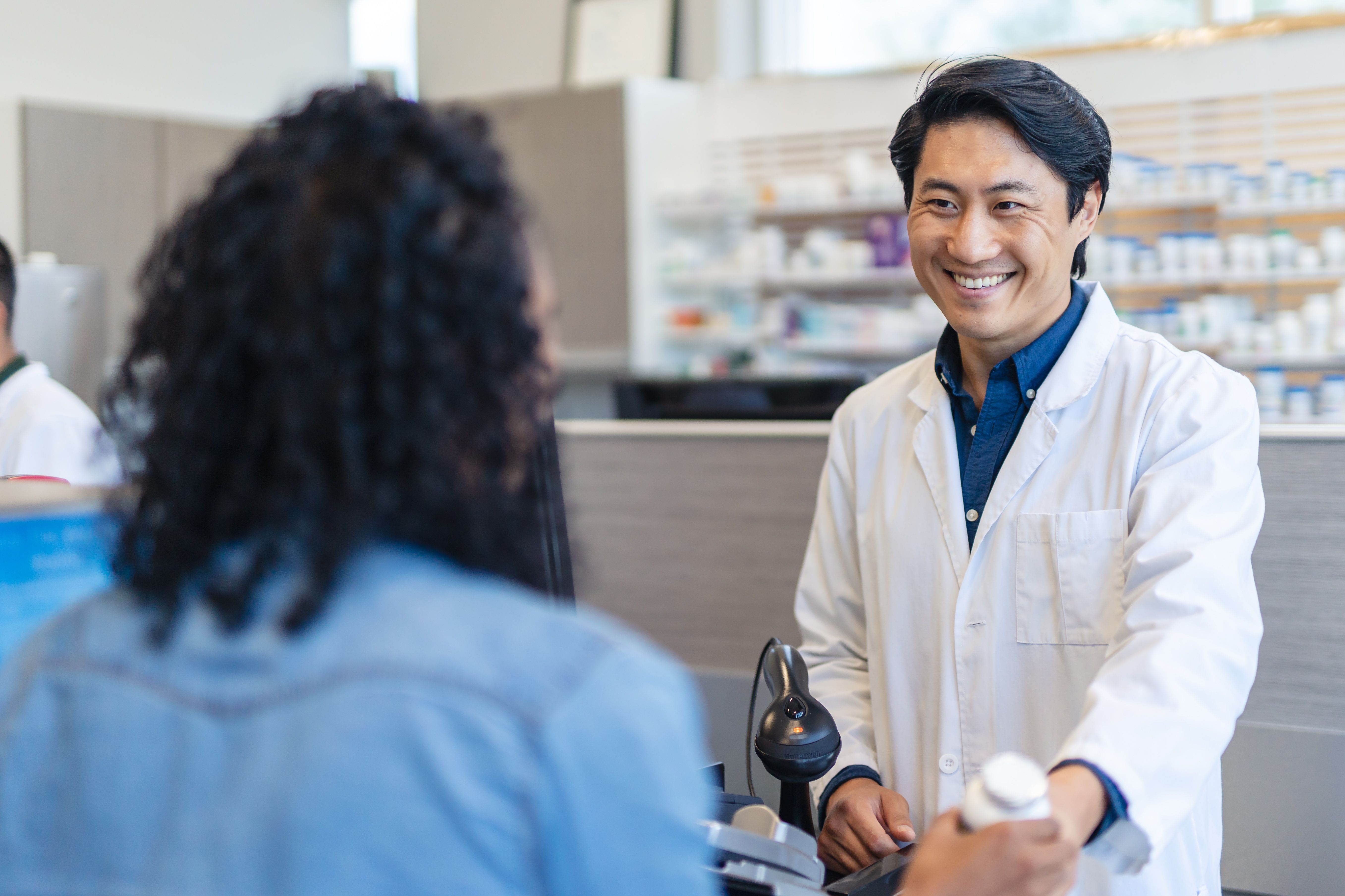 pharmacist helping customer
