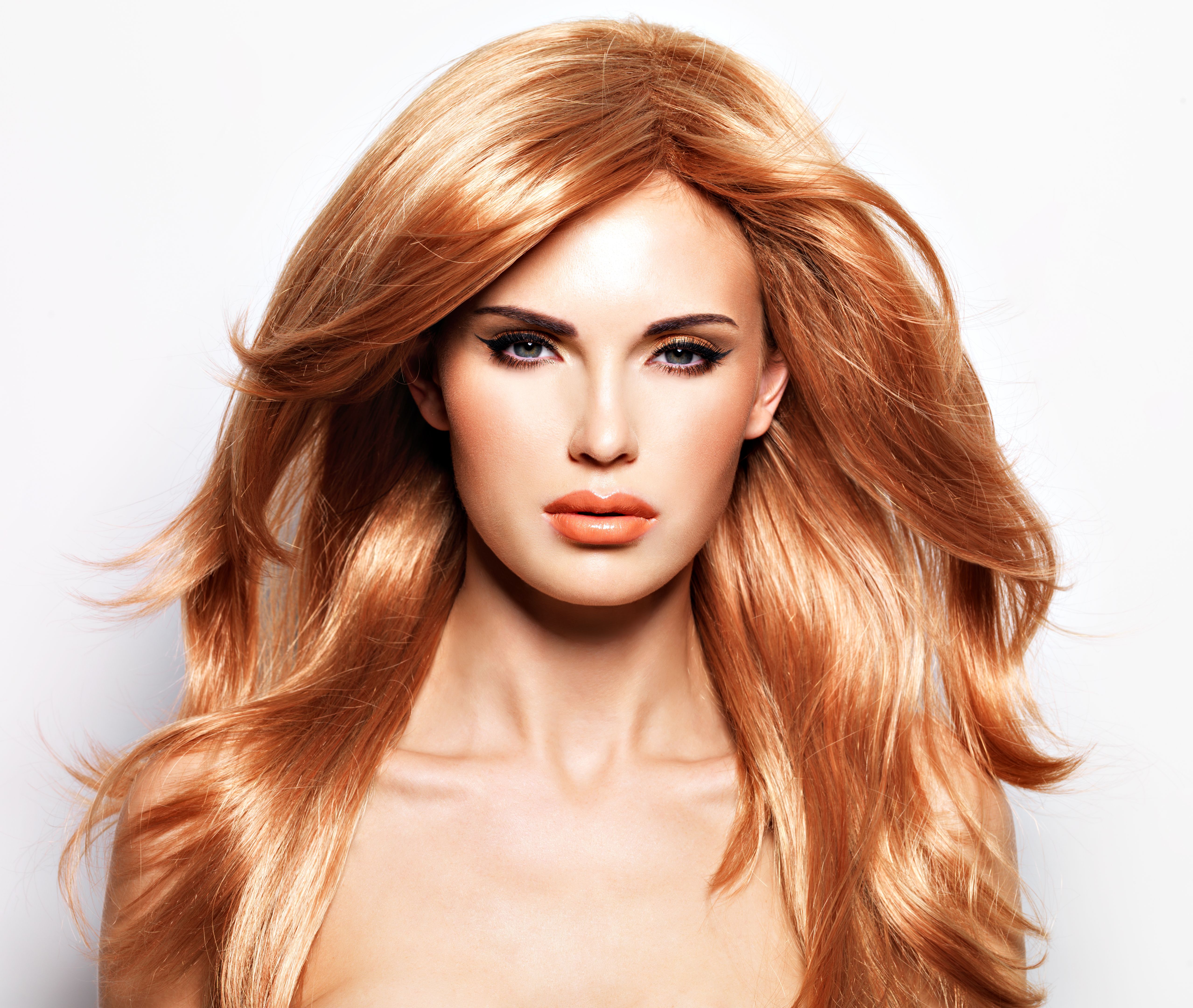 Portrait of a beautiful woman with long straight red hair