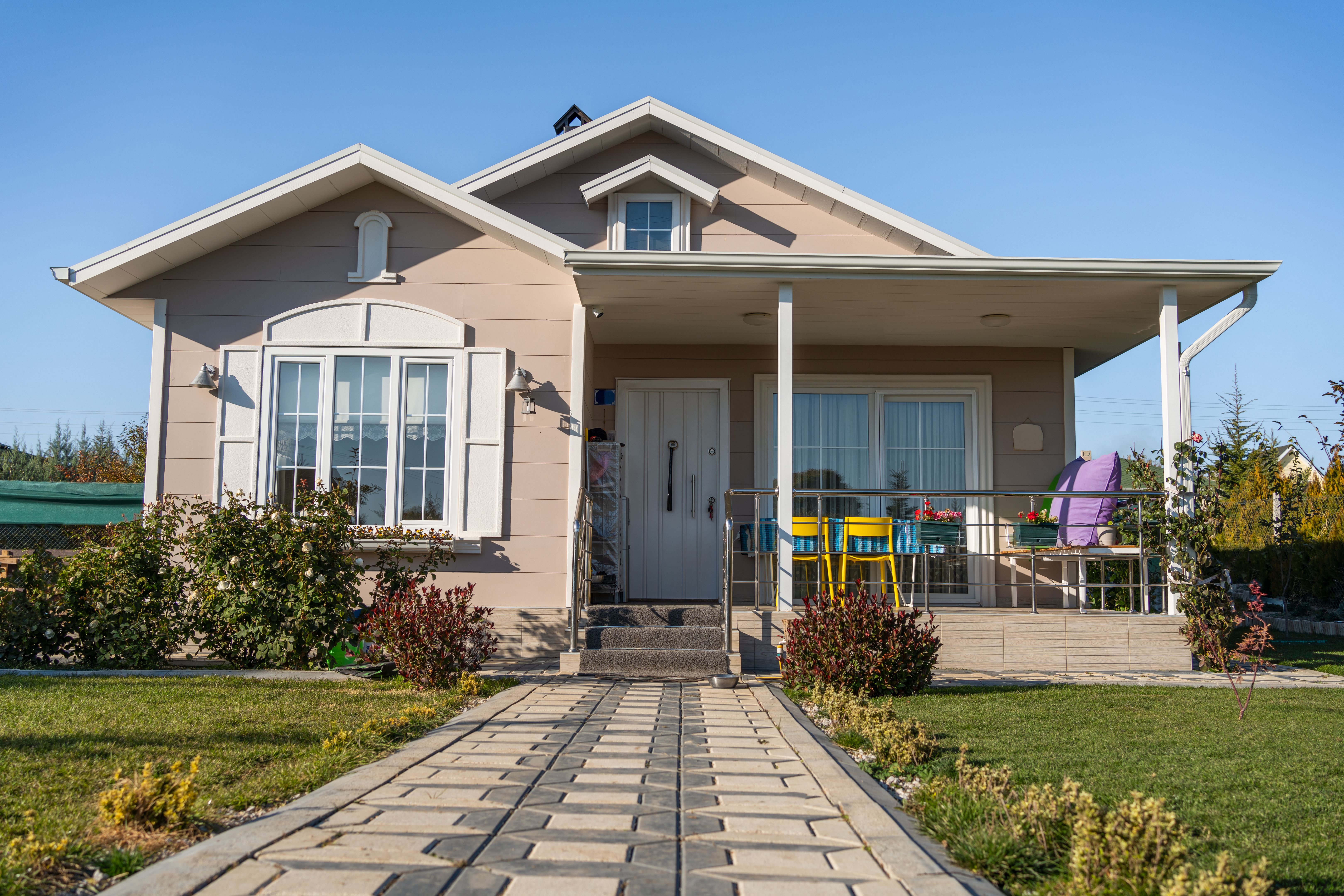 Classic family detached house with blue sky background
