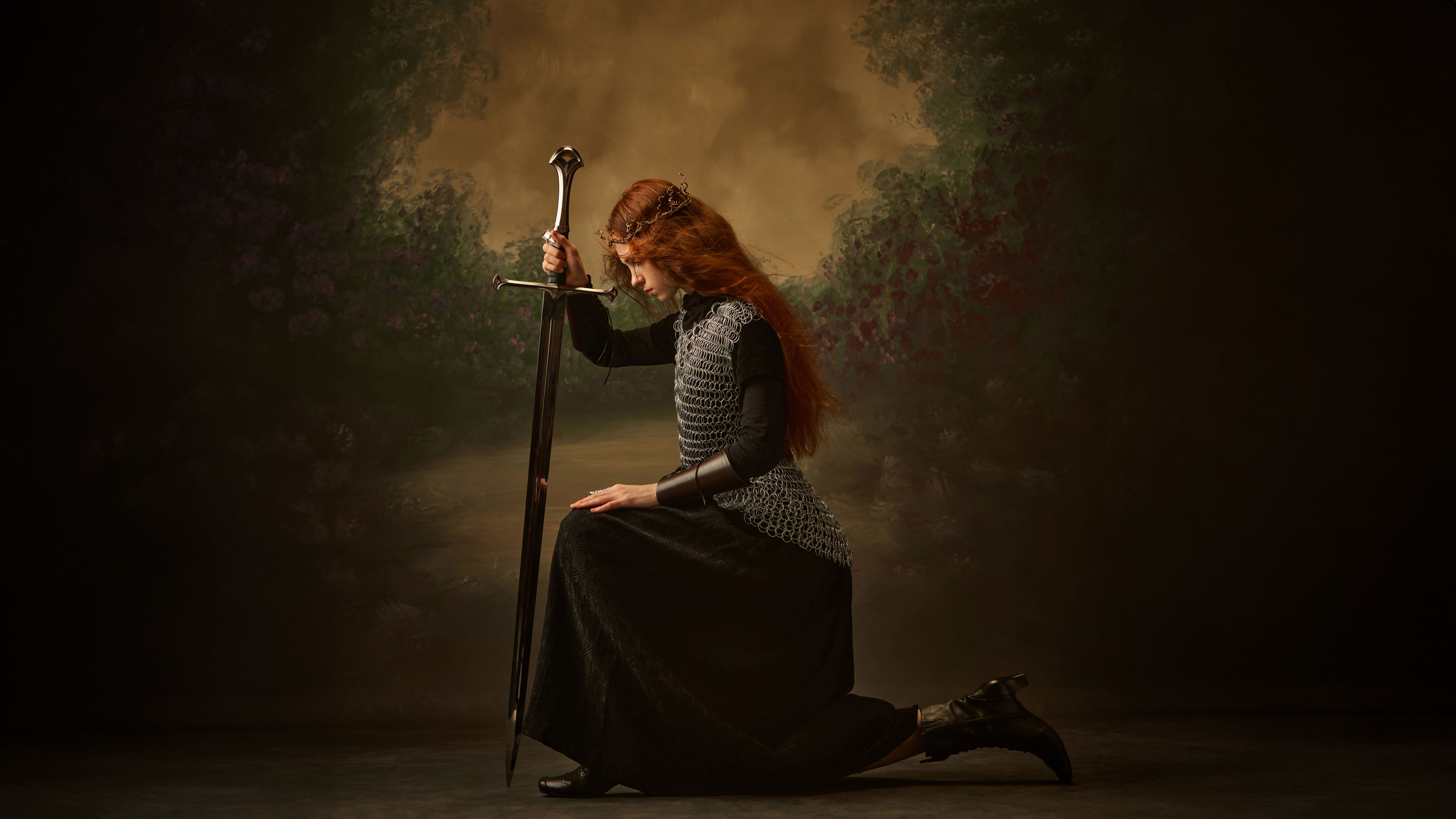 Pensive warrior princess, woman kneeling with sword, in contemplative pose against vintage background.