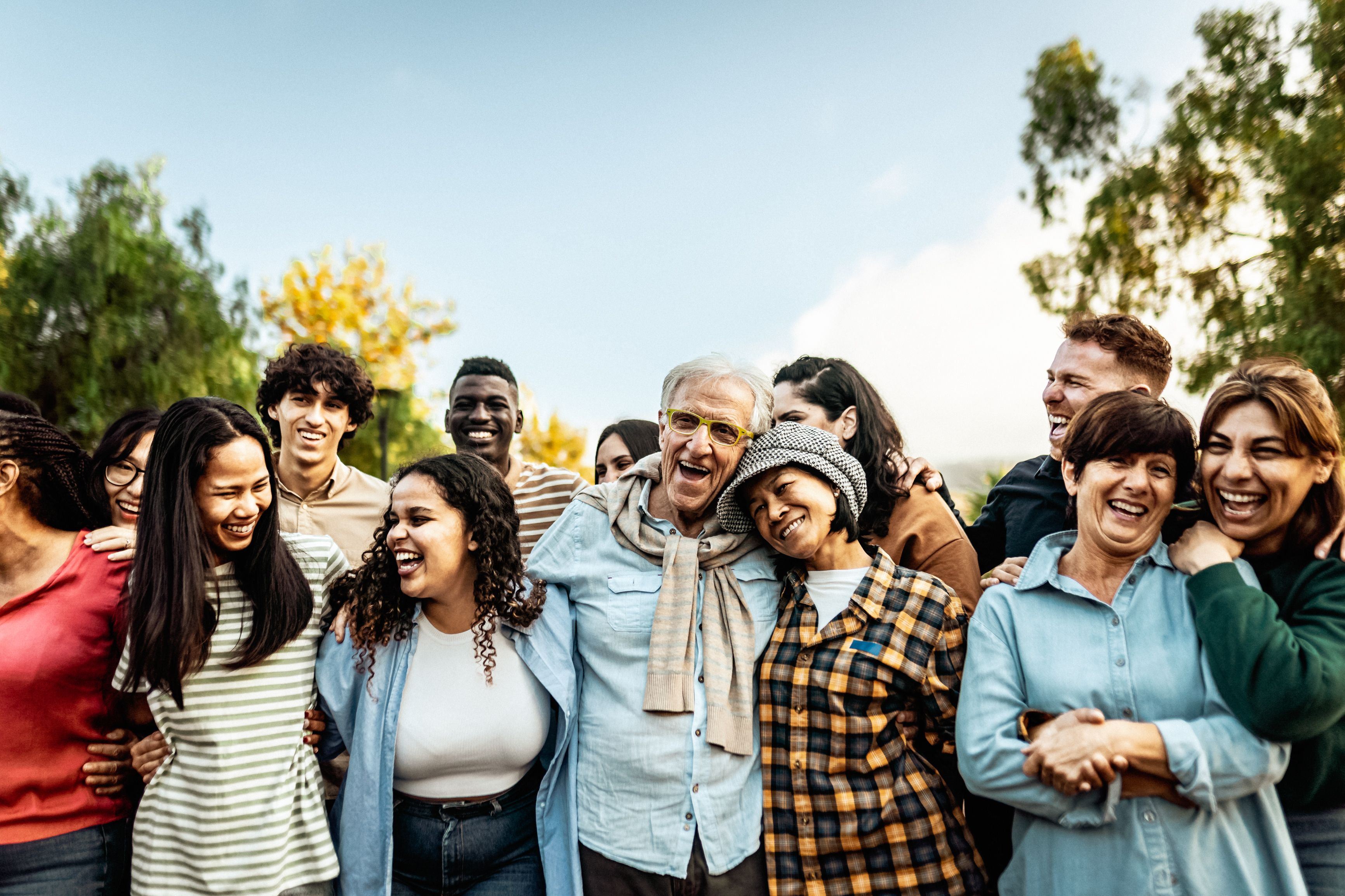 Happy multigenerational people having fun together in a public park - Diversity concept Happy multigenerational people having fun together in a public park - Diversity concept