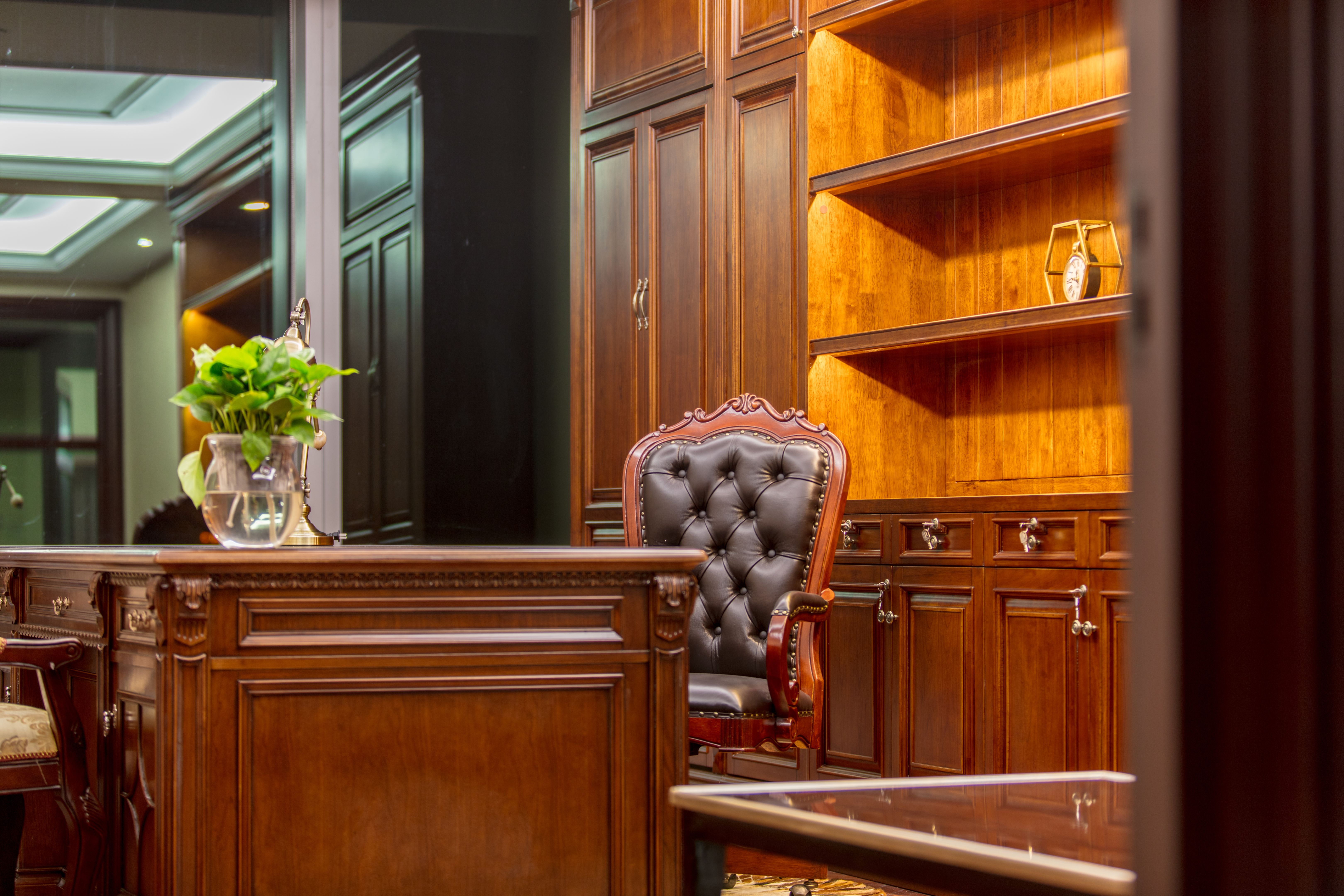 Interior of vintage luxury office with leather chairs and wooden table