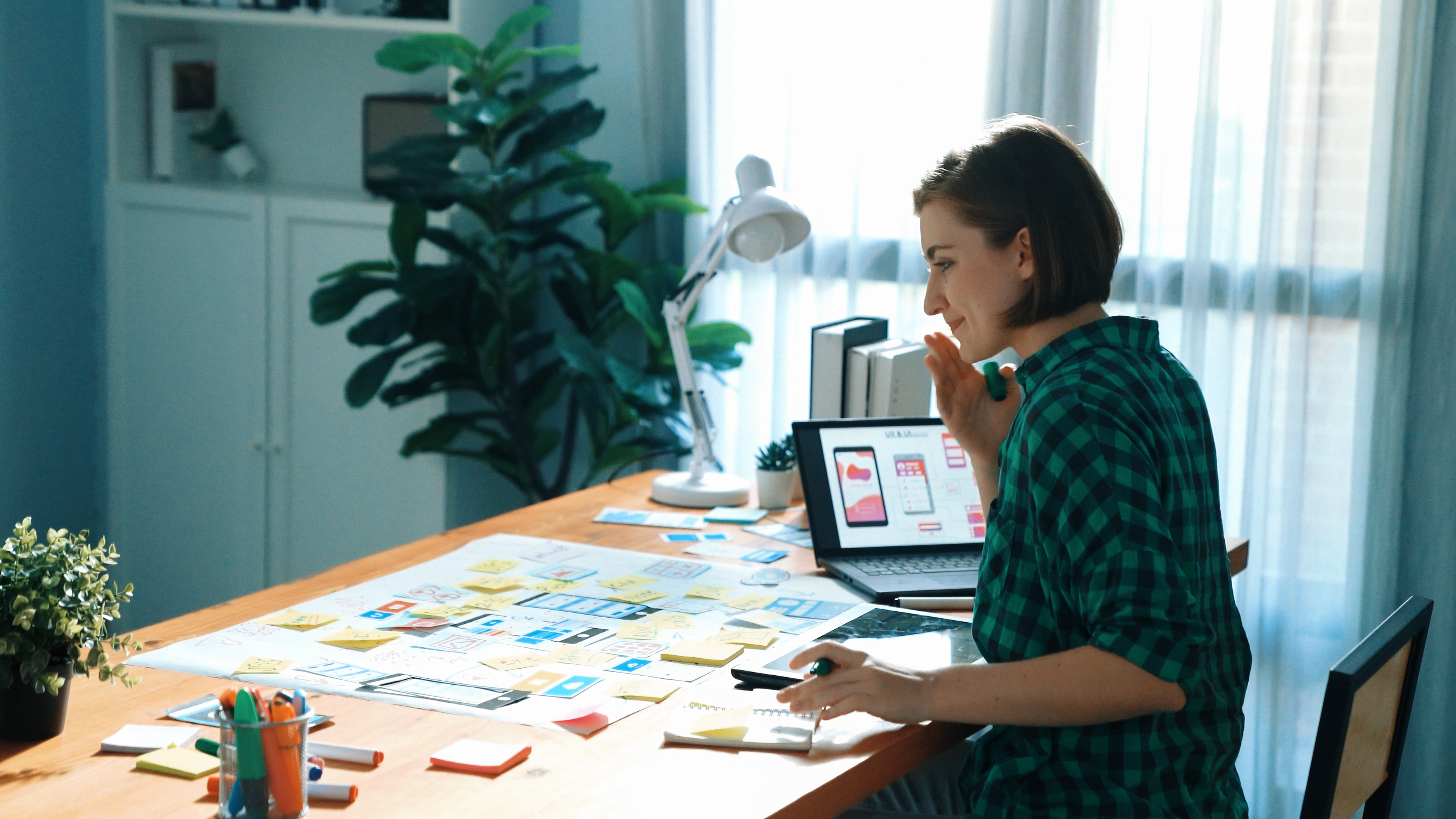 Top view of manager design UX, UI system while sitting at table. Convocation.