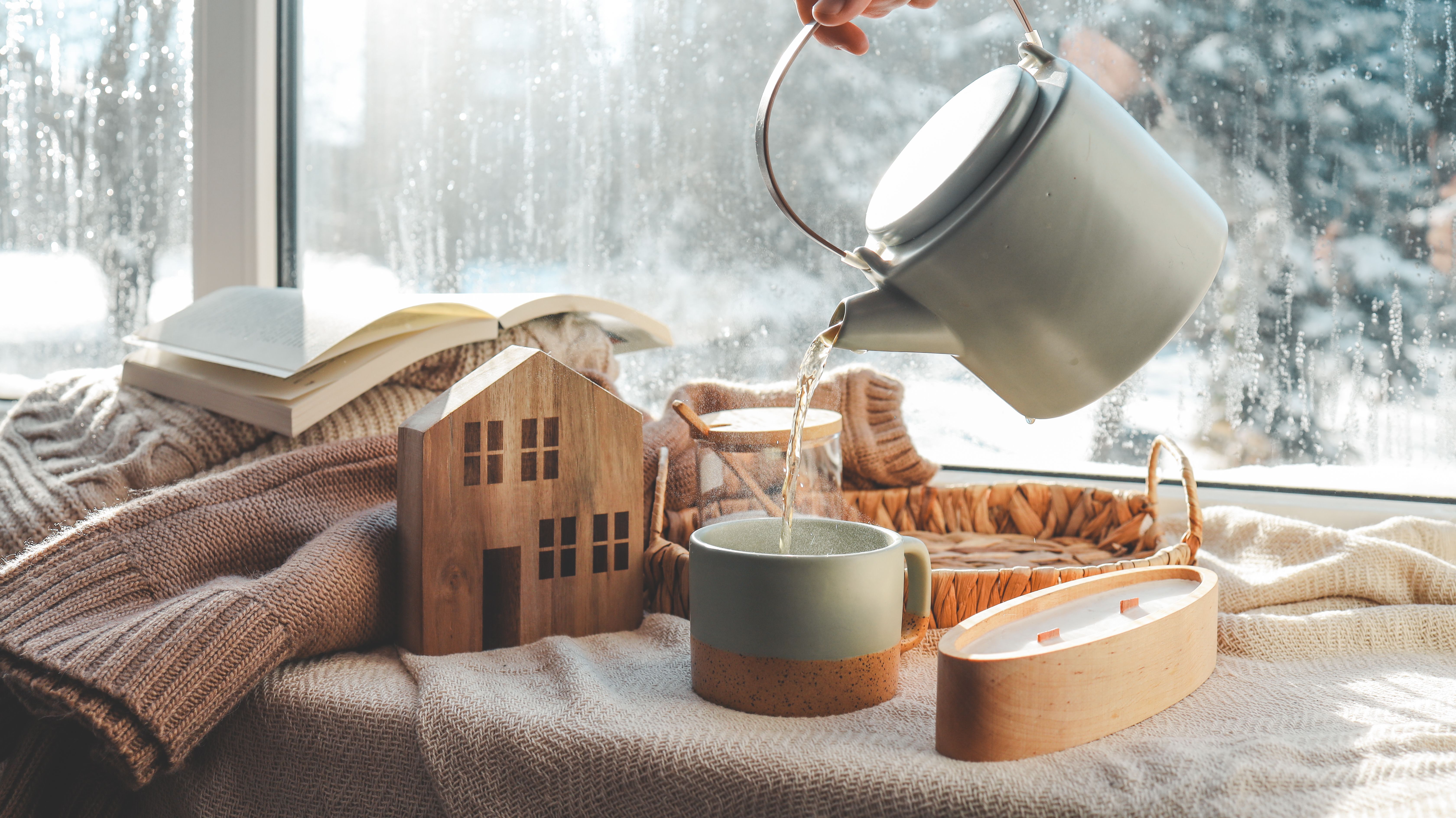 Pouring a cup of tea, cozy home photo