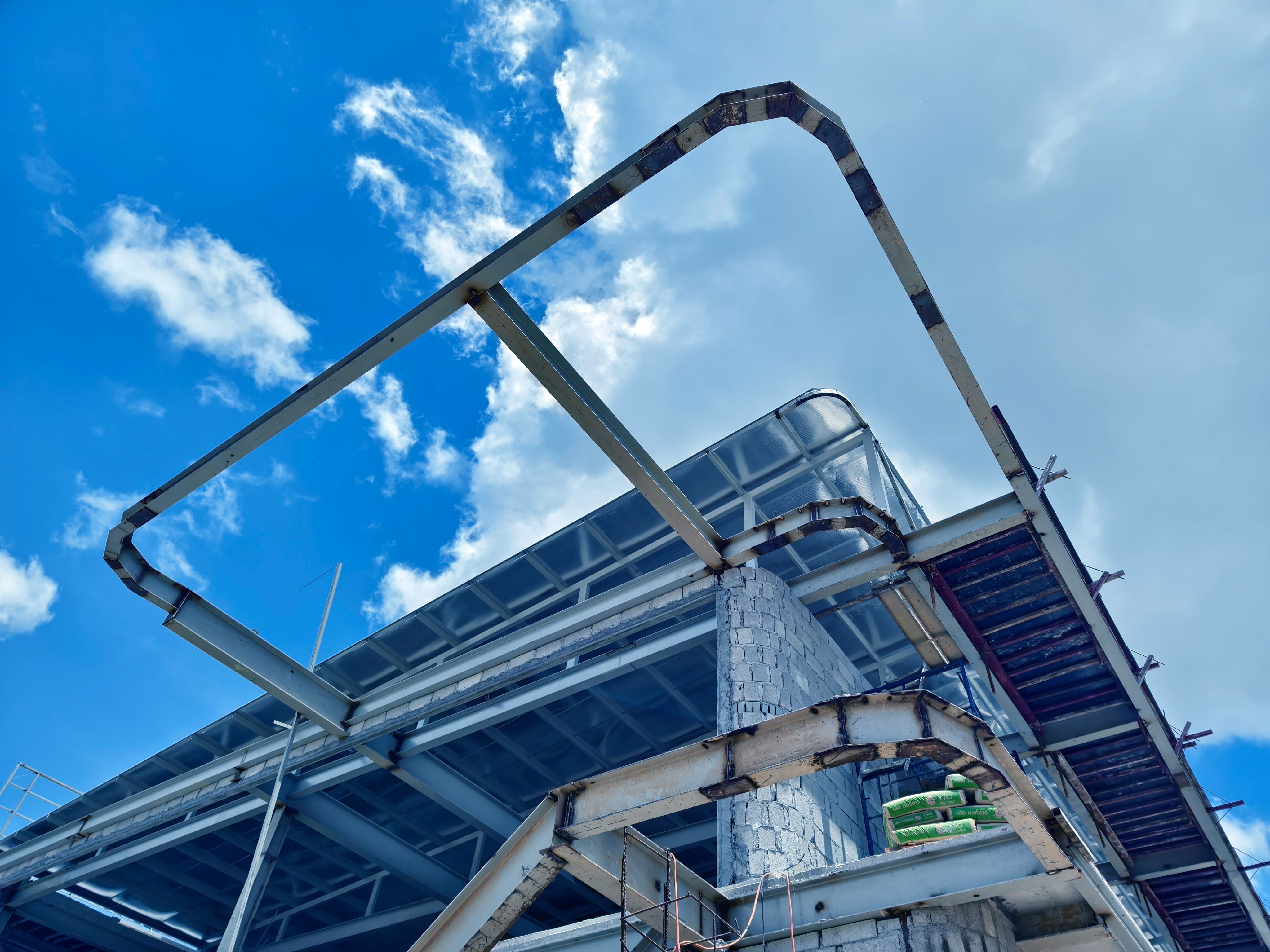 A large and impressive modern building is under construction. A large and impressive modern building is under construction.