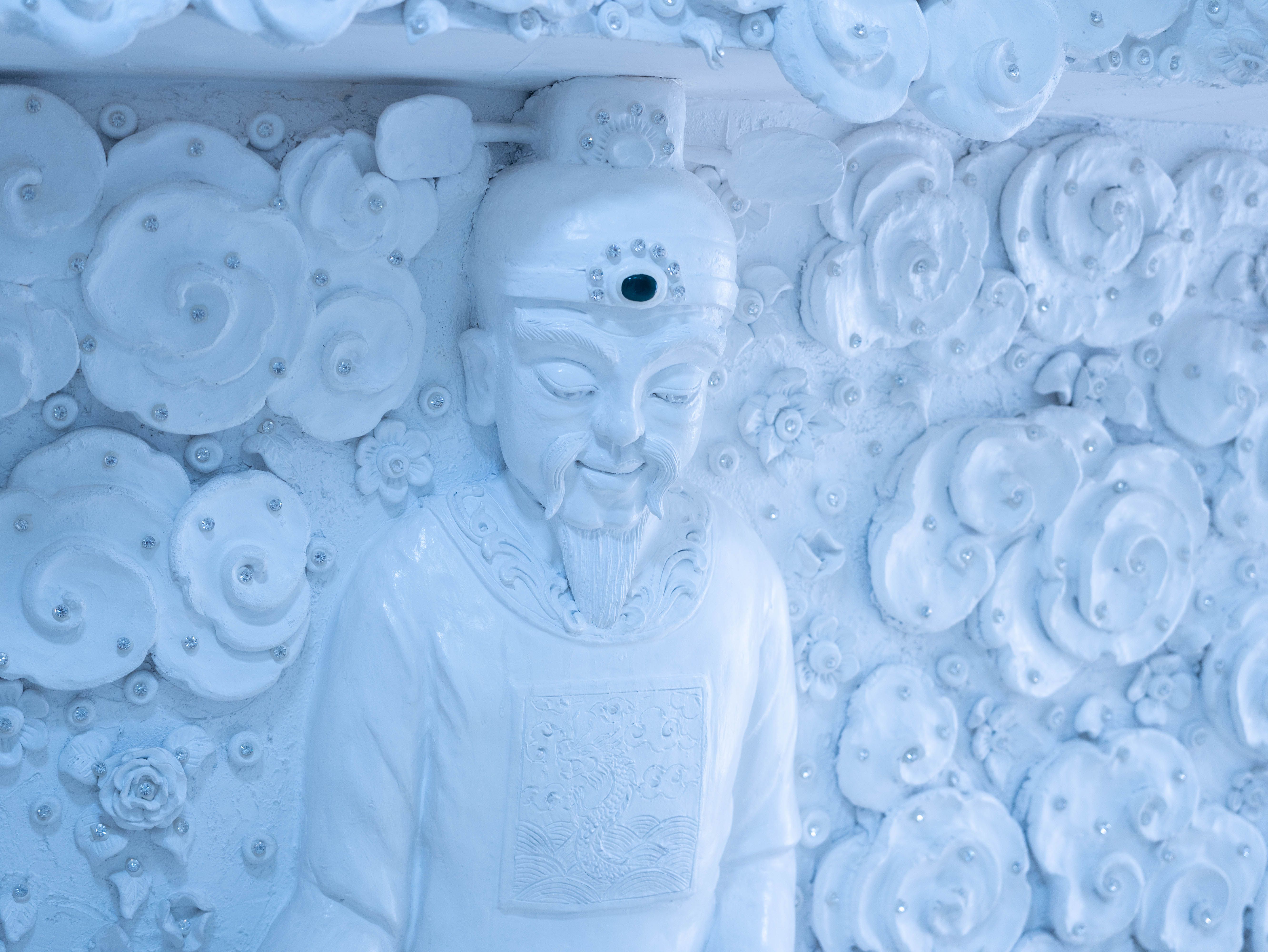 Marble sculpture symbolizing Buddhism in Asia inside a temple in Thailand.