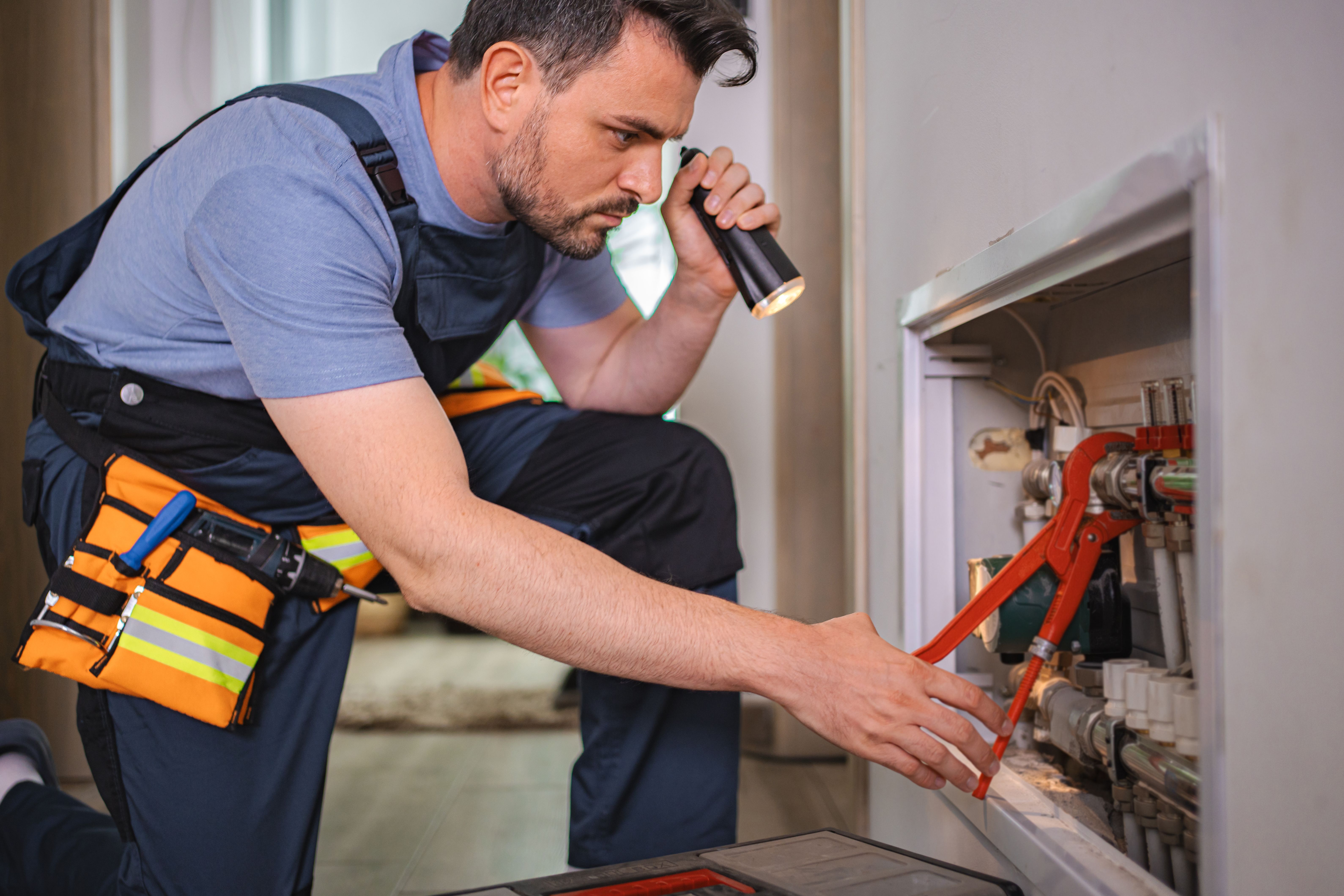 technician inspecting fireplace
