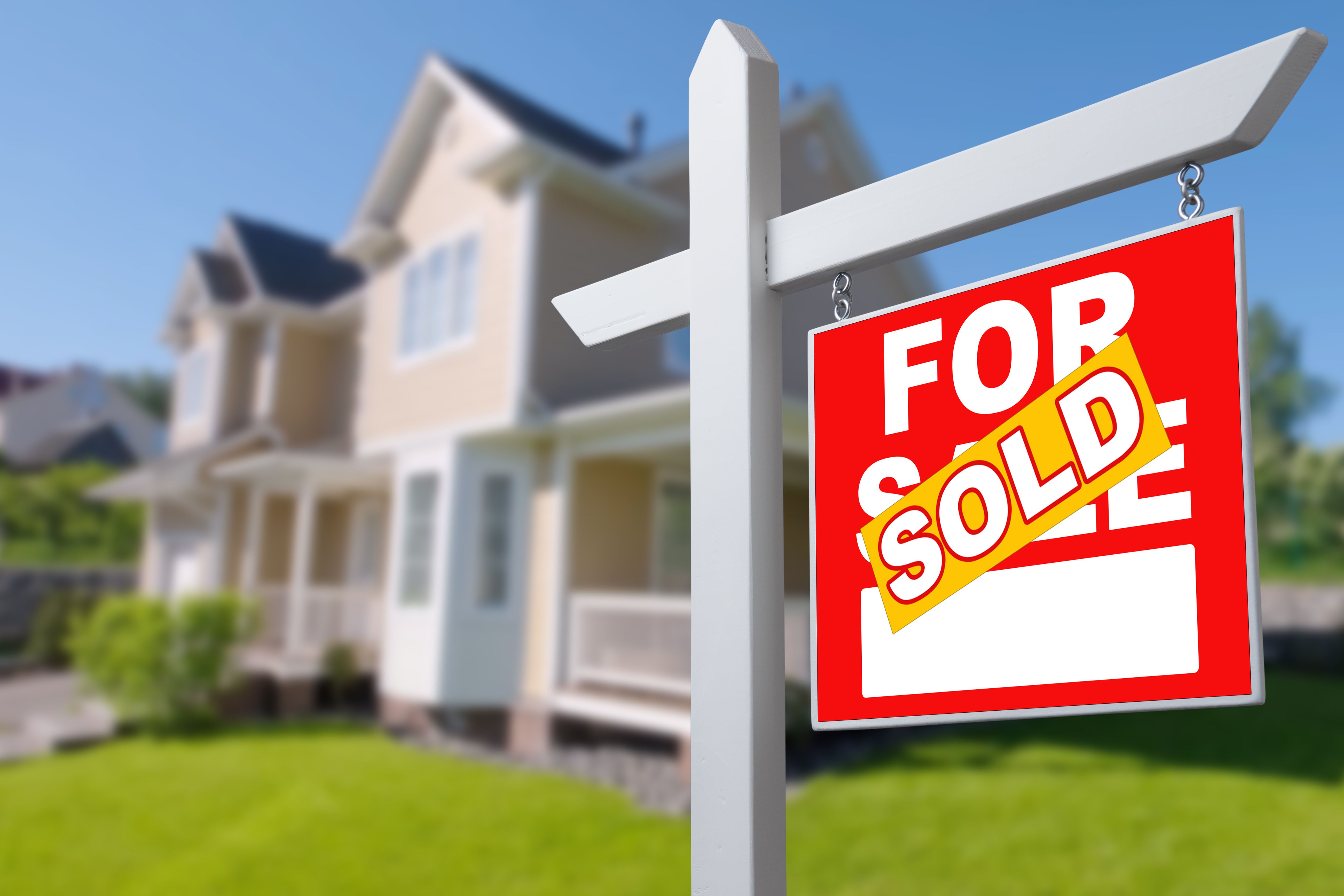 Sold Home For Sale Sign in Front of New House.