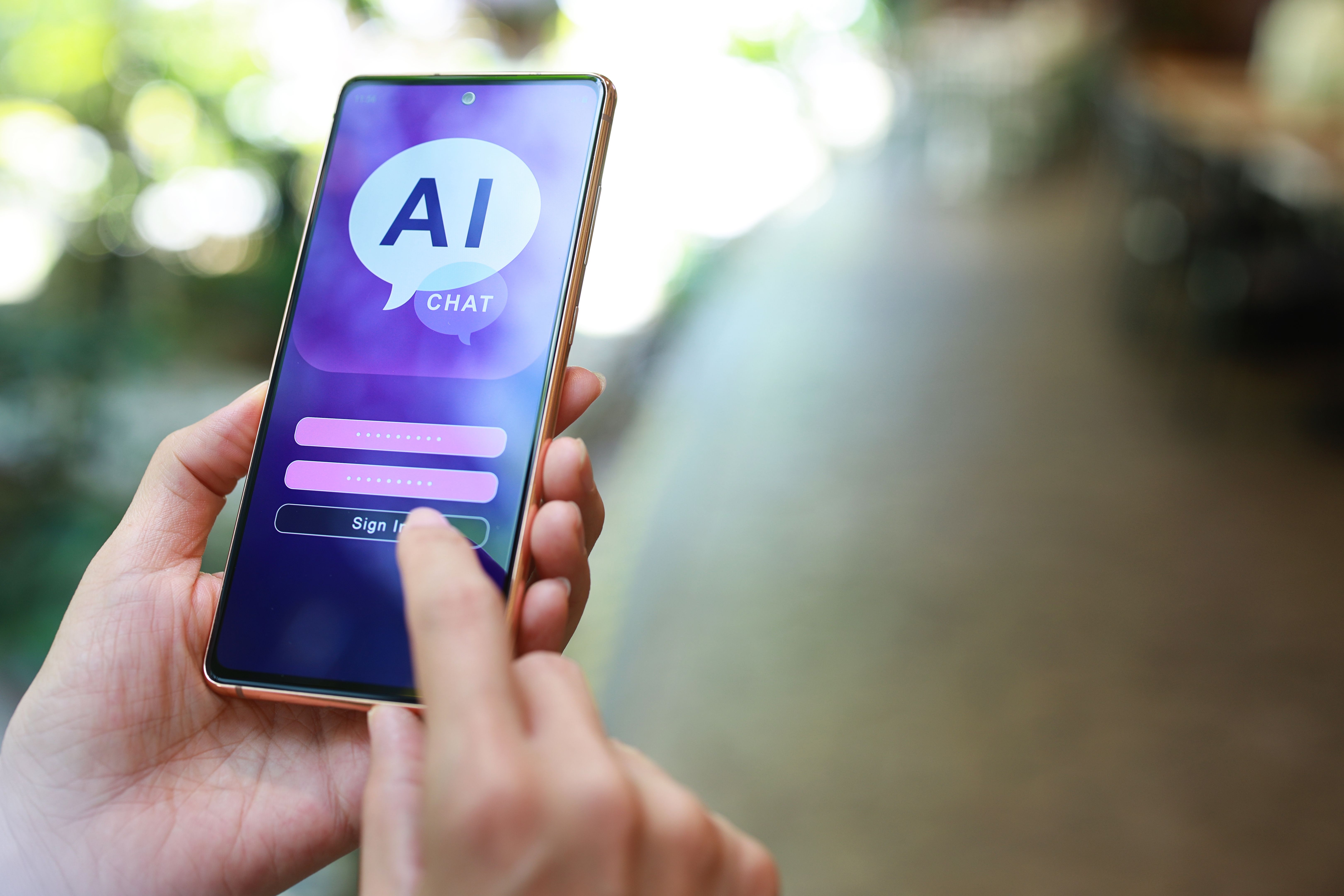 Close-up woman using smartphone chatting with AI chatbot