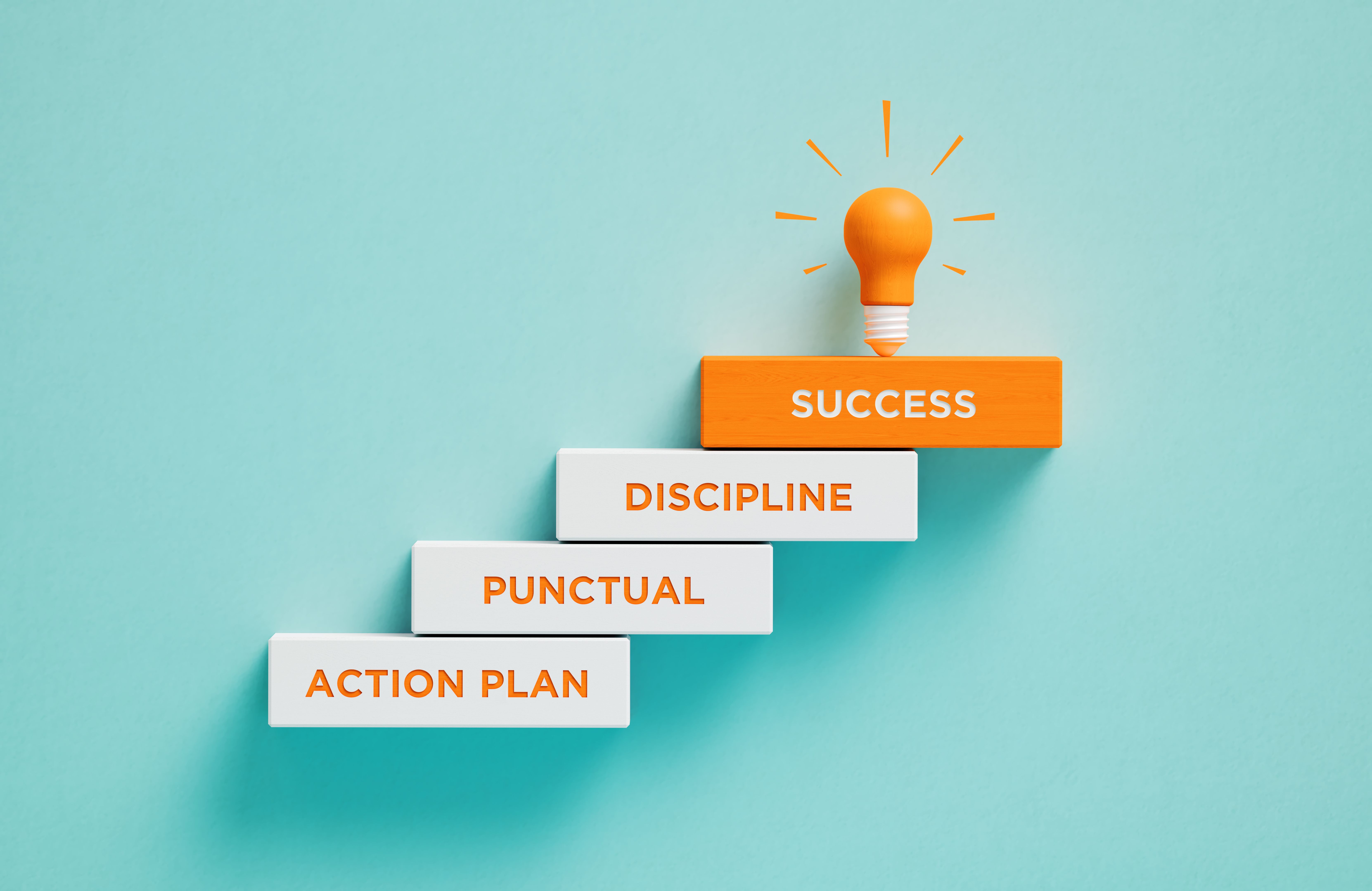 Orange Light Bulb And Success Written Wood Blocks On Blue Background Orange Light Bulb And Success Written Wood Blocks On Blue Background