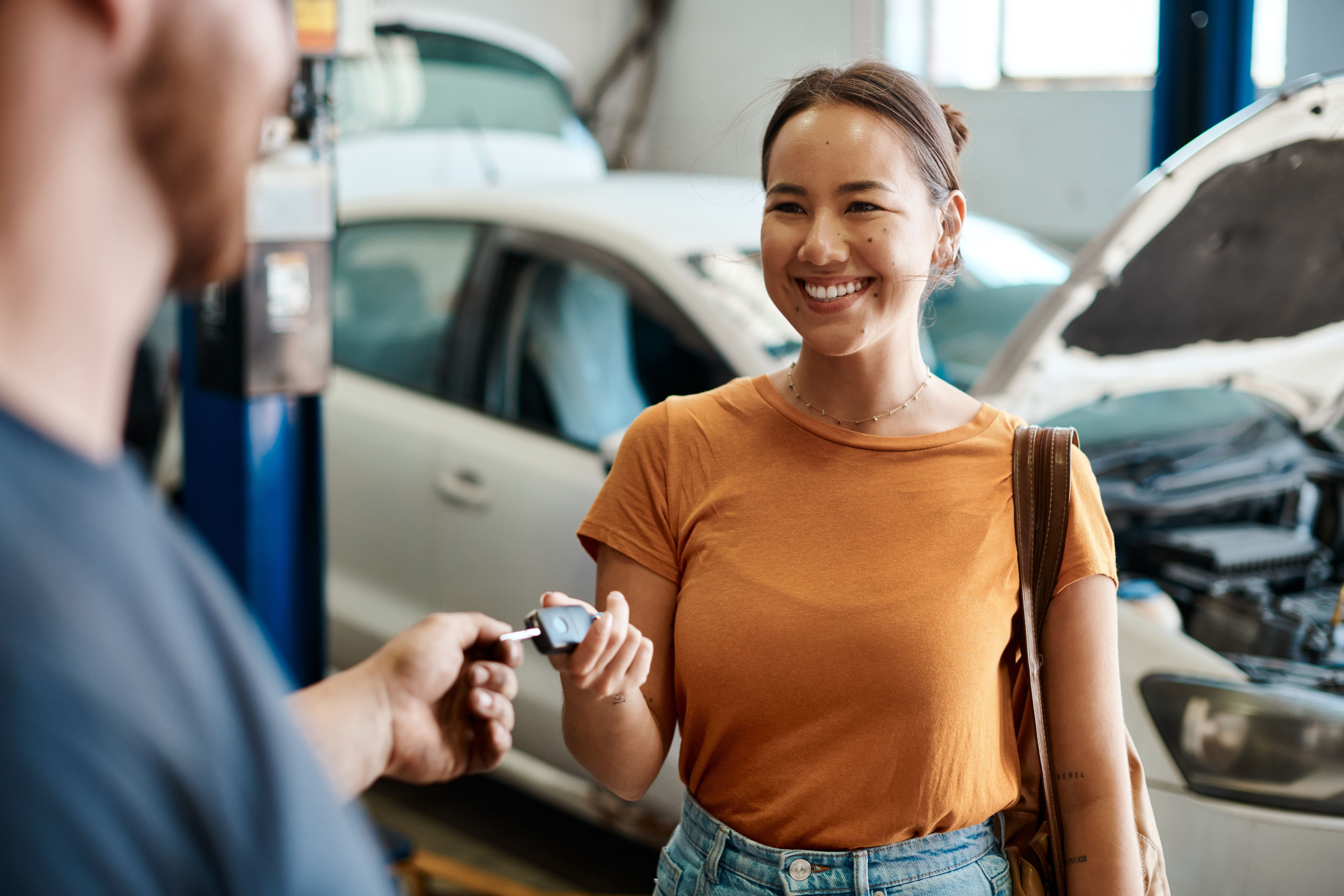 mechanic inspecting car