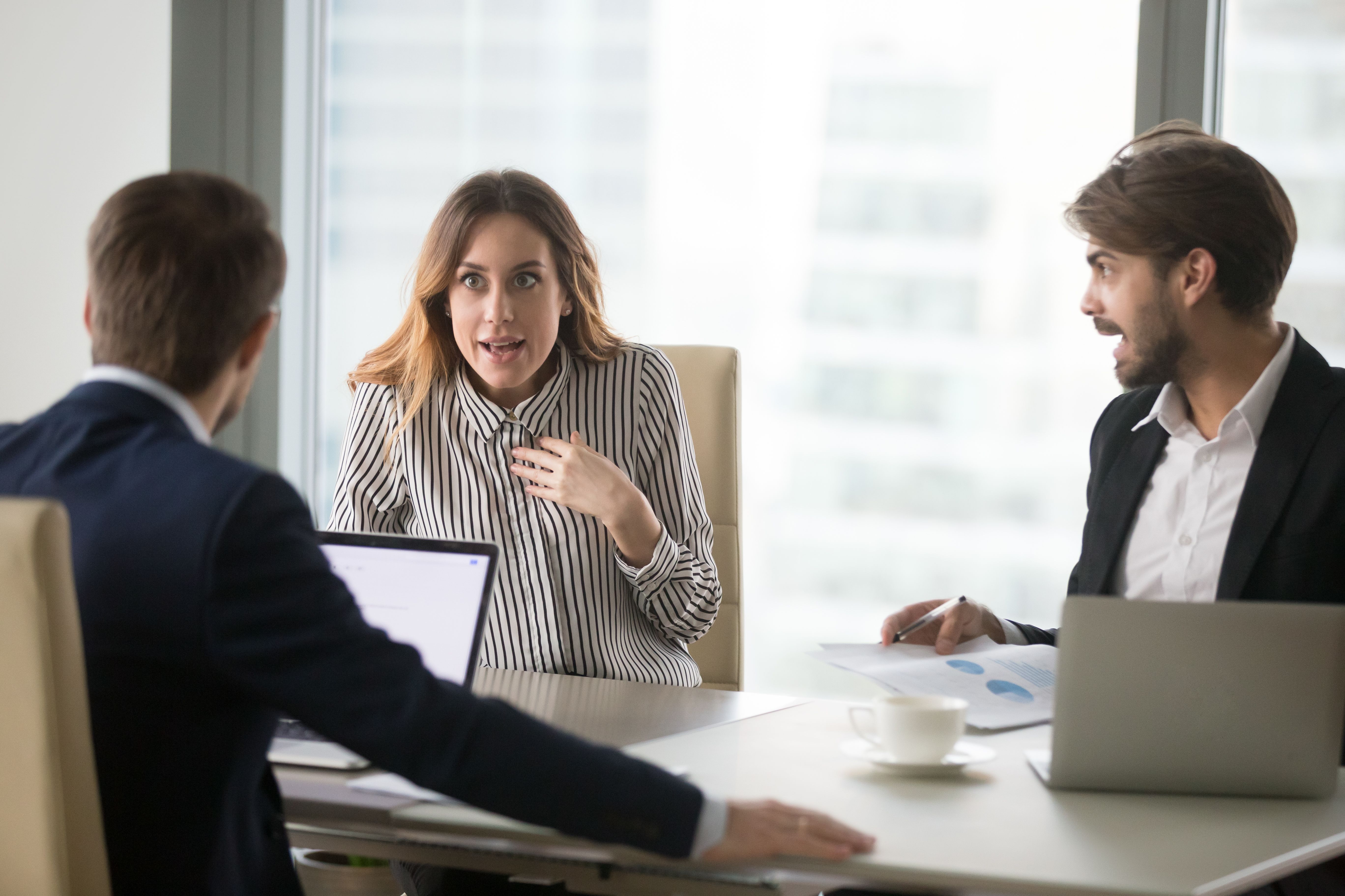 Angry man shouting at indignant female colleague. Angry man shouting at indignant female colleague.