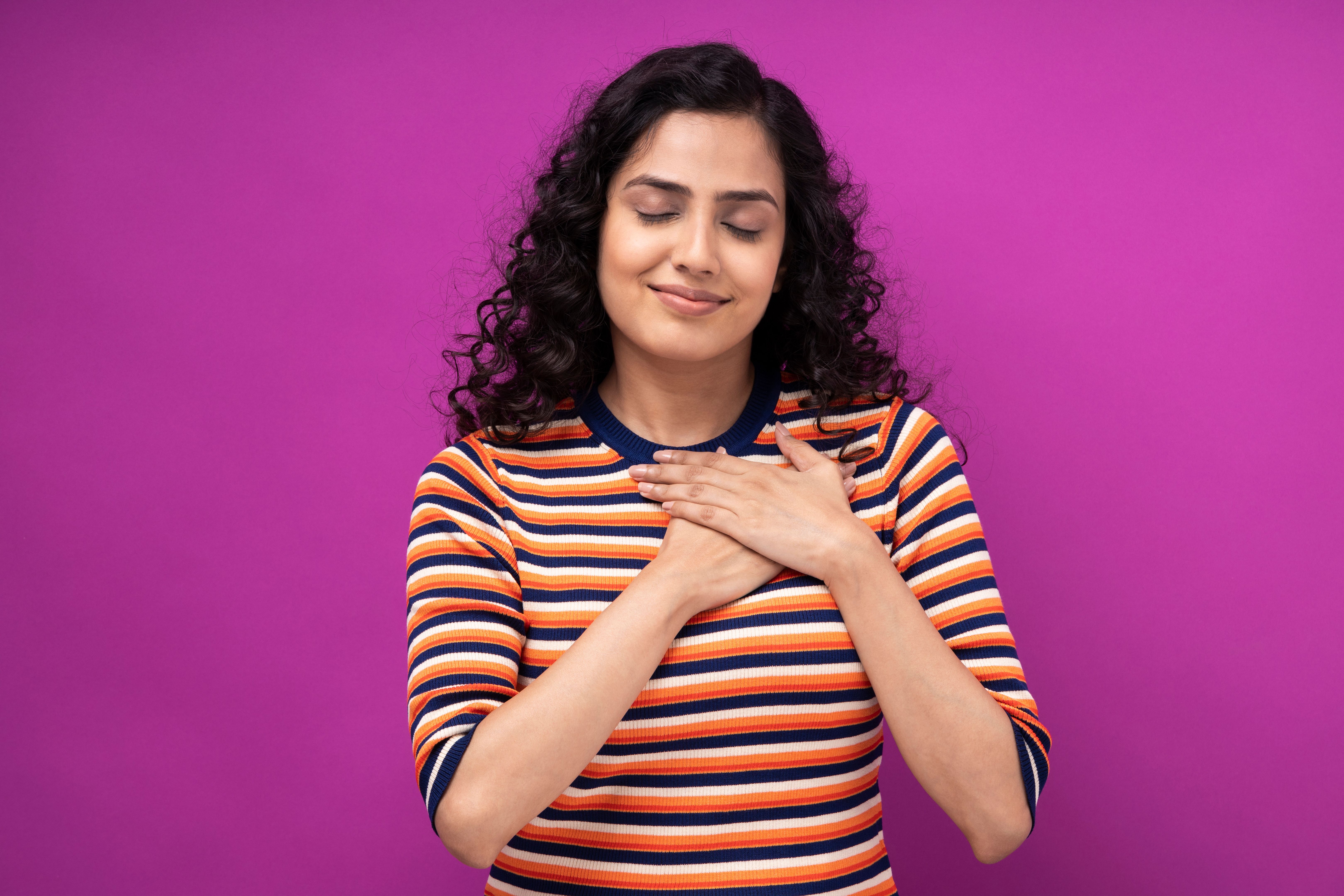 Portrait of young women standing isolated over purple background Portrait of young women standing isolated over purple background