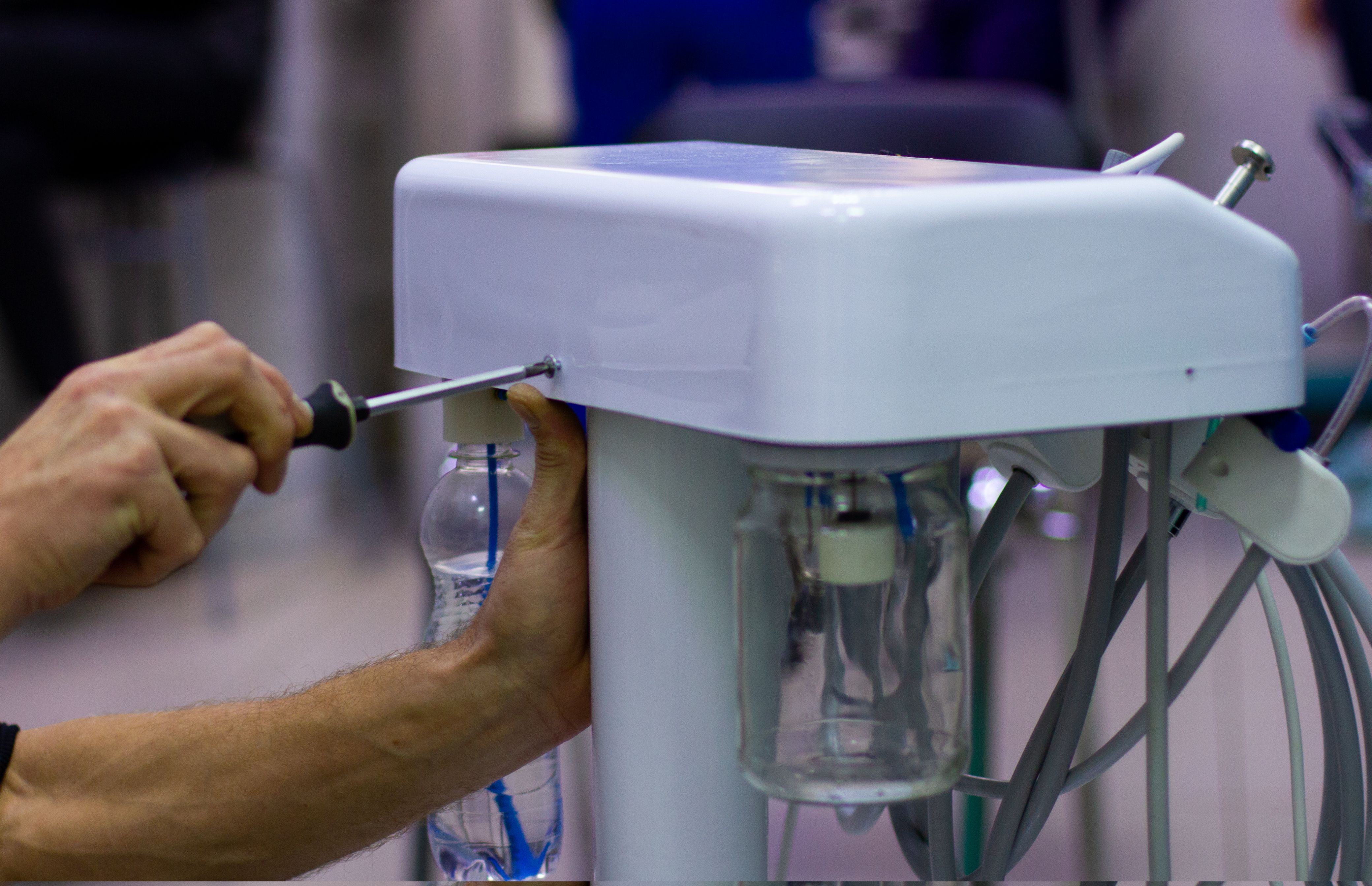 technician repairing medical equipment