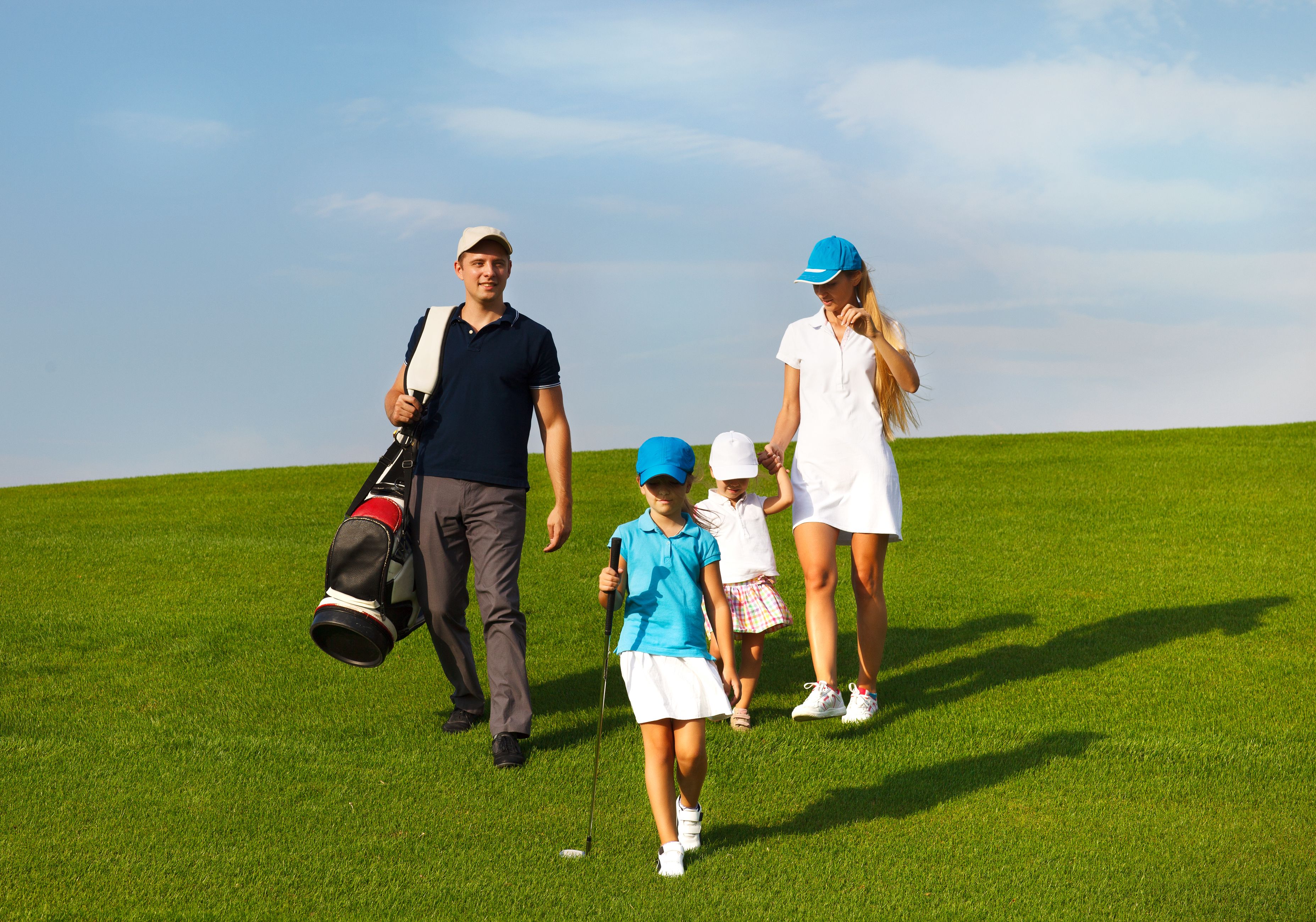family golfing