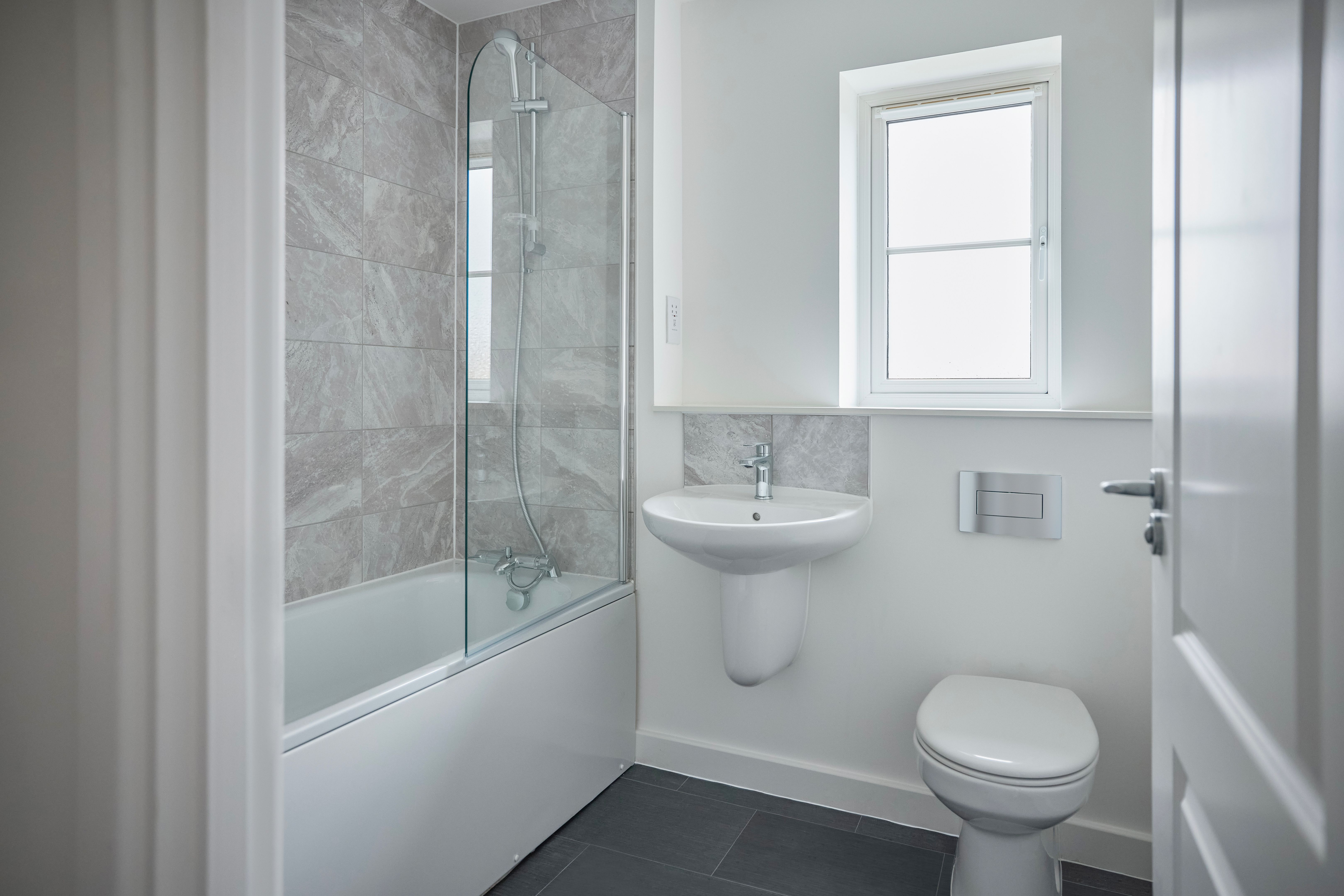 Empty Modern Bathroom With Shower Fitted In New Home On Moving In Day