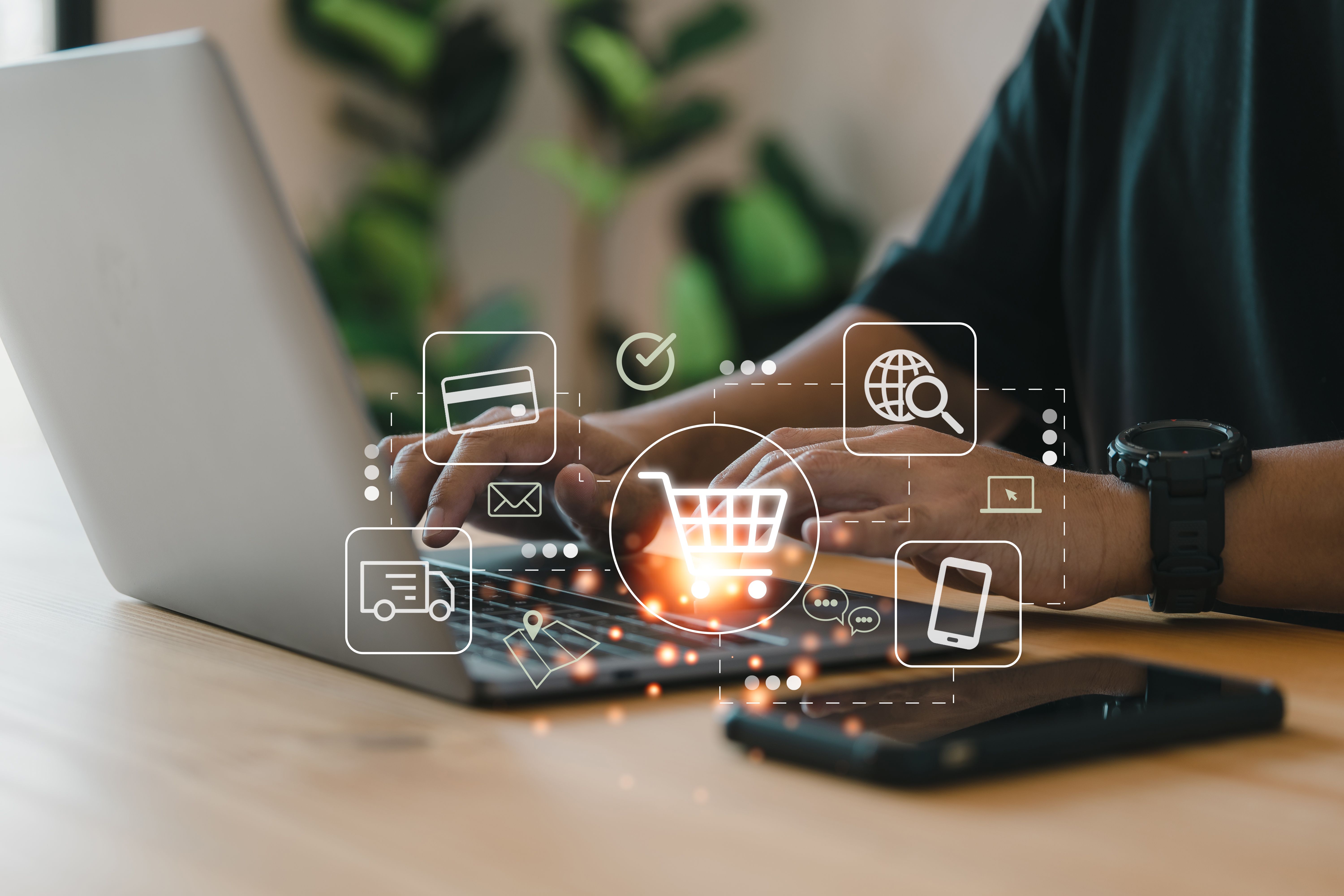 Online shopping and e-commerce technology concept, shopper using computer laptop to input order with trolley credit card delivery truck. Online shopping and e-commerce technology concept, shopper using computer laptop to input order with trolley credit card delivery truck.