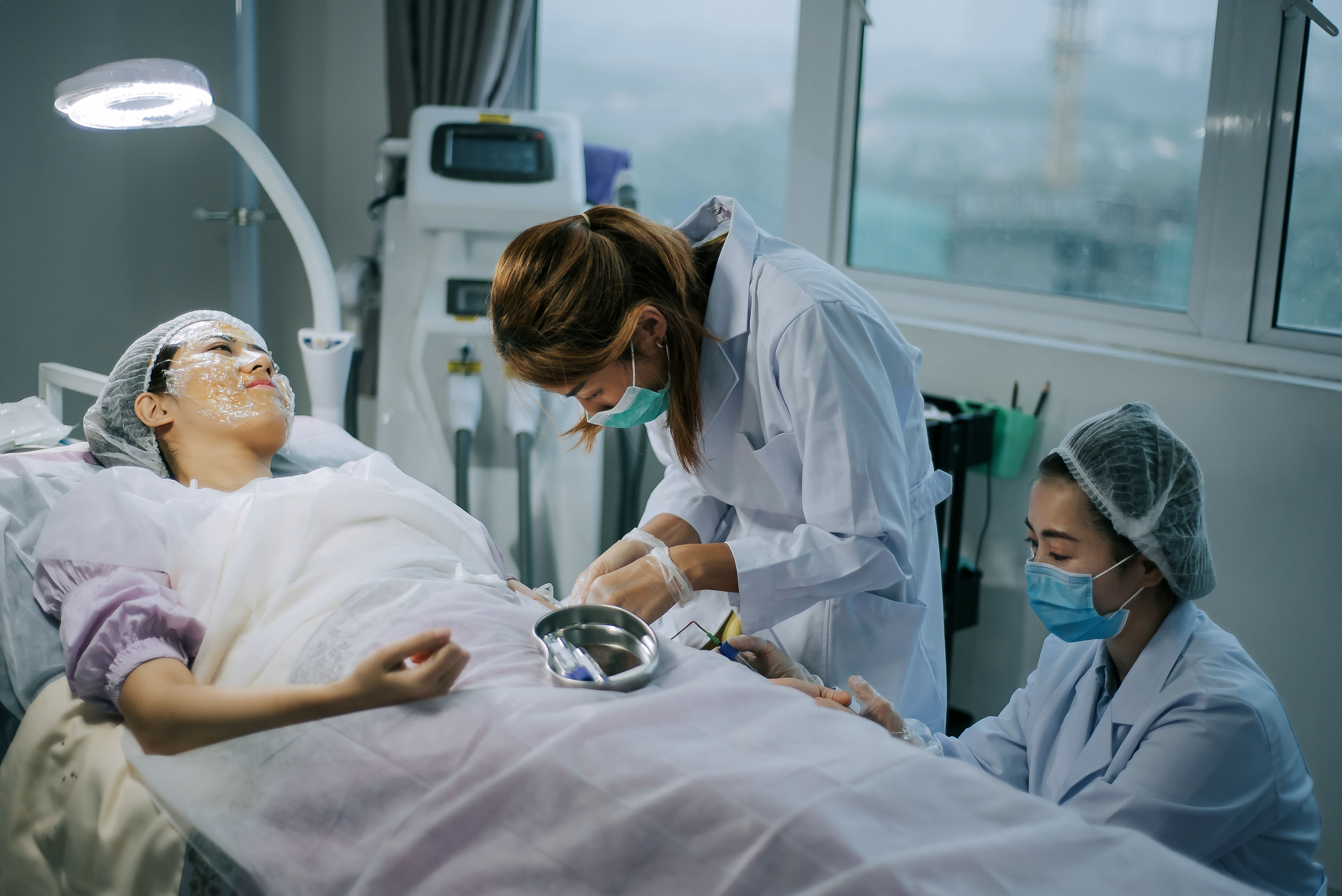 Healthcare professionals providing patient care during a charitable medical program, showcasing nonprofit compliance and commitment to ethical community services.