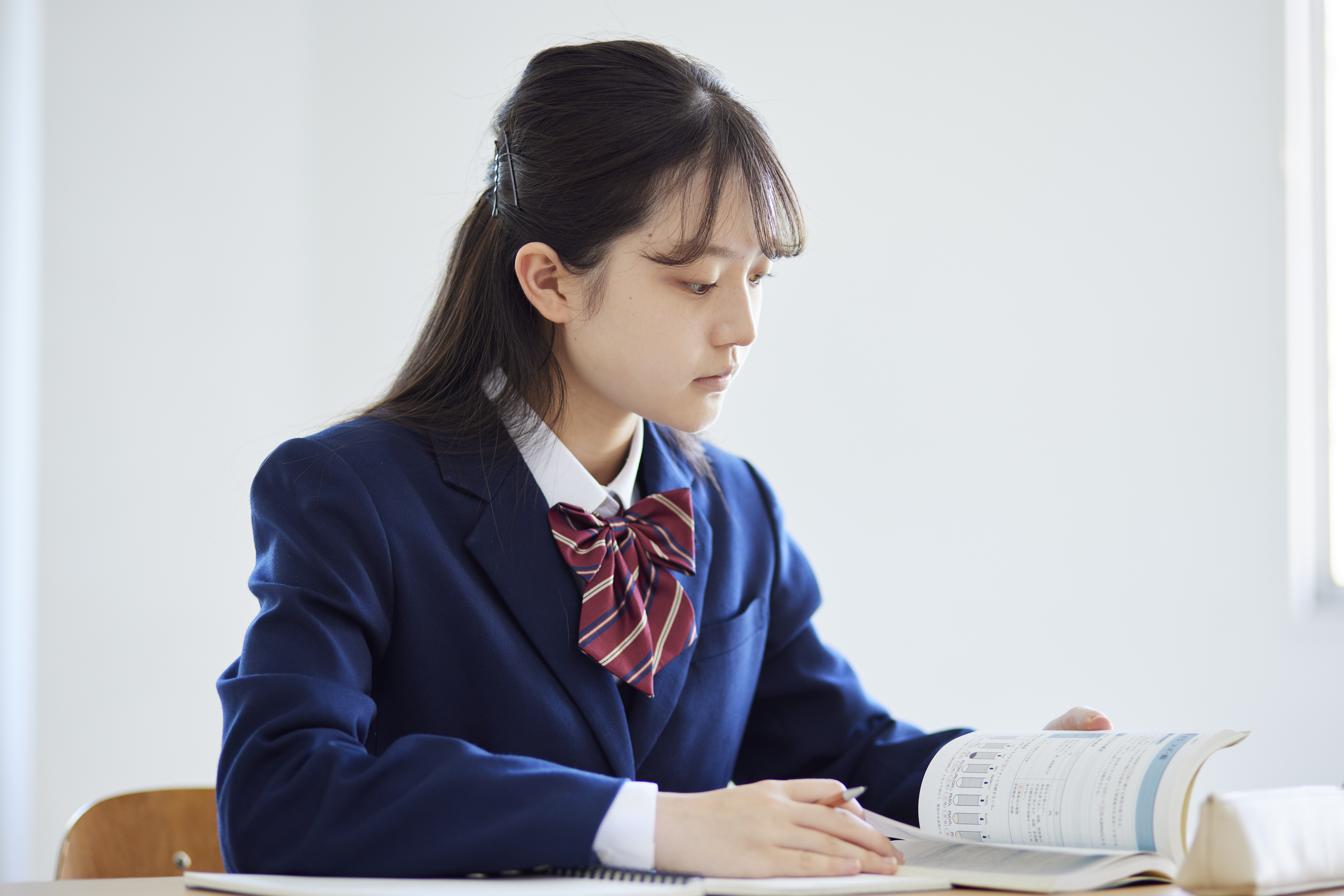 Japanese female high school student taking classes in a high school classroom