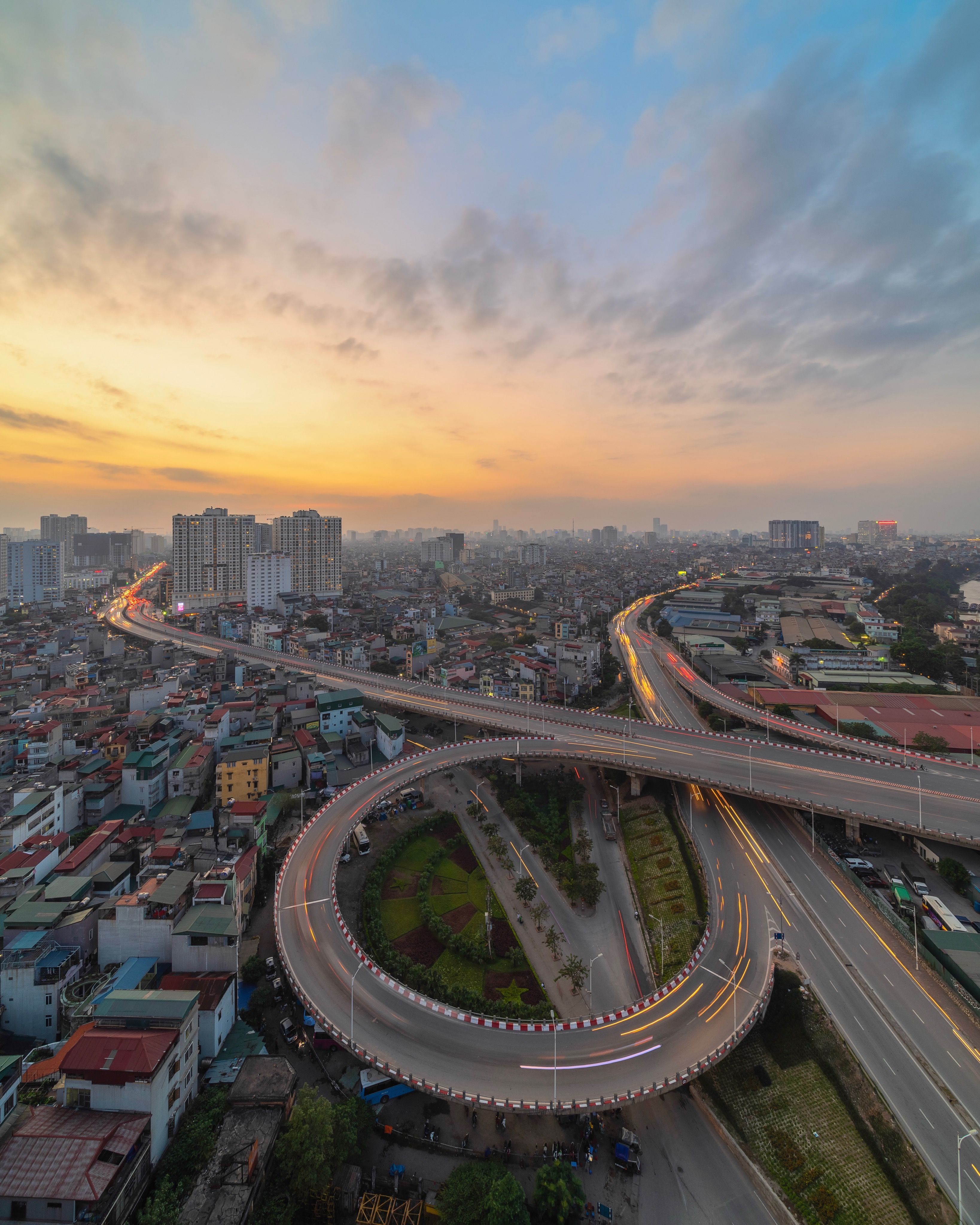 Aerial View Of Bridge And Buildings Against Sky In City During Sunset