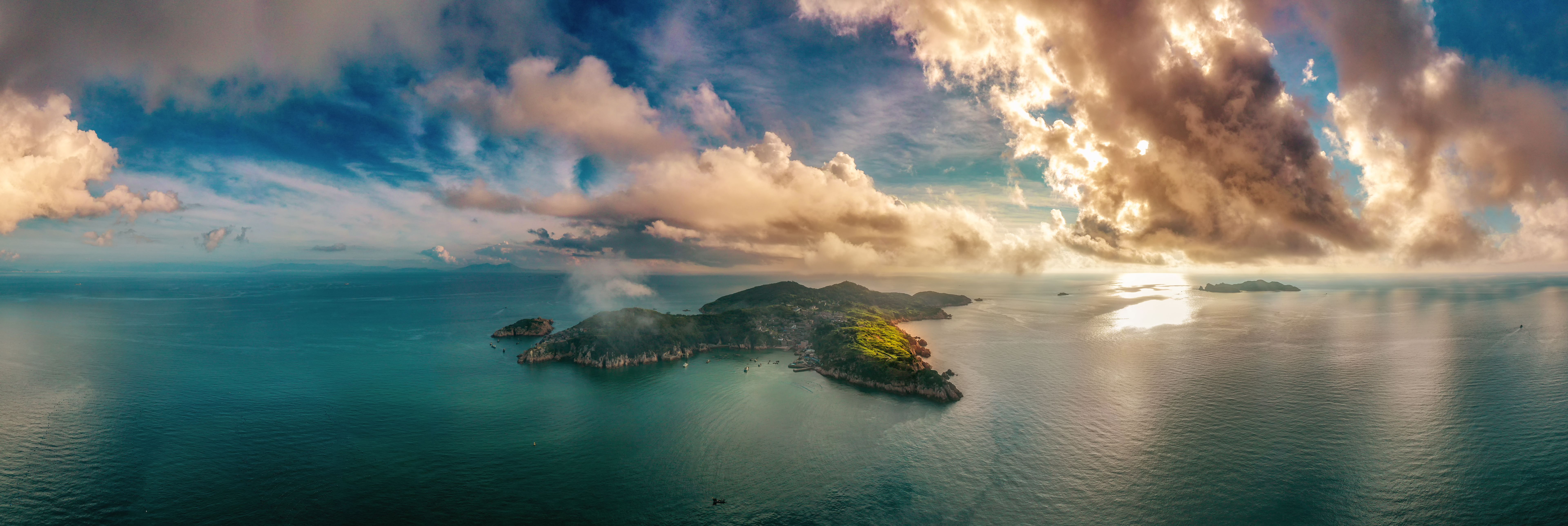 Aerial photography of  sea; a small island in the sea