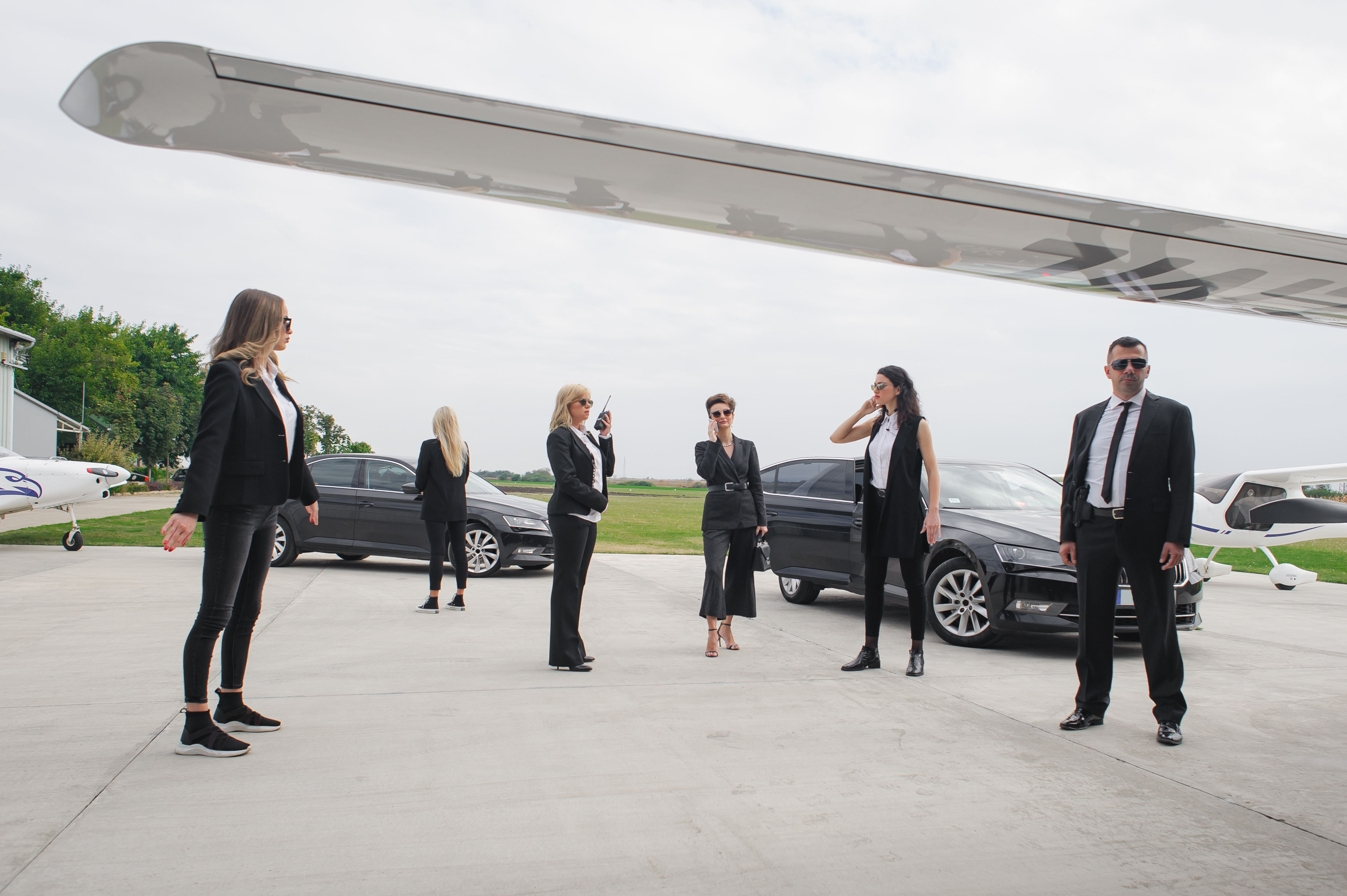 Female male security bodyguards team protect VIP celebrity public person