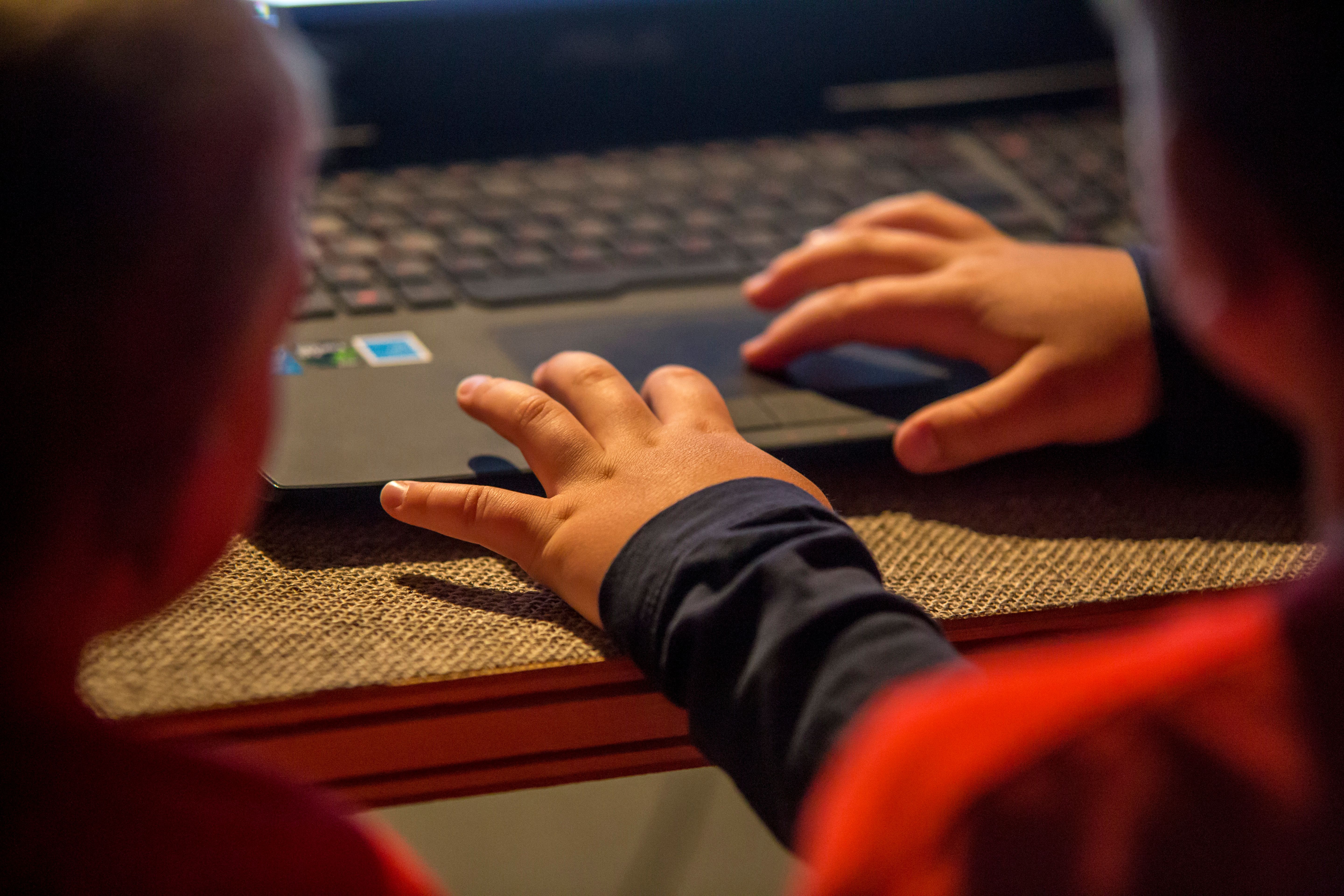 children hands with digital devices