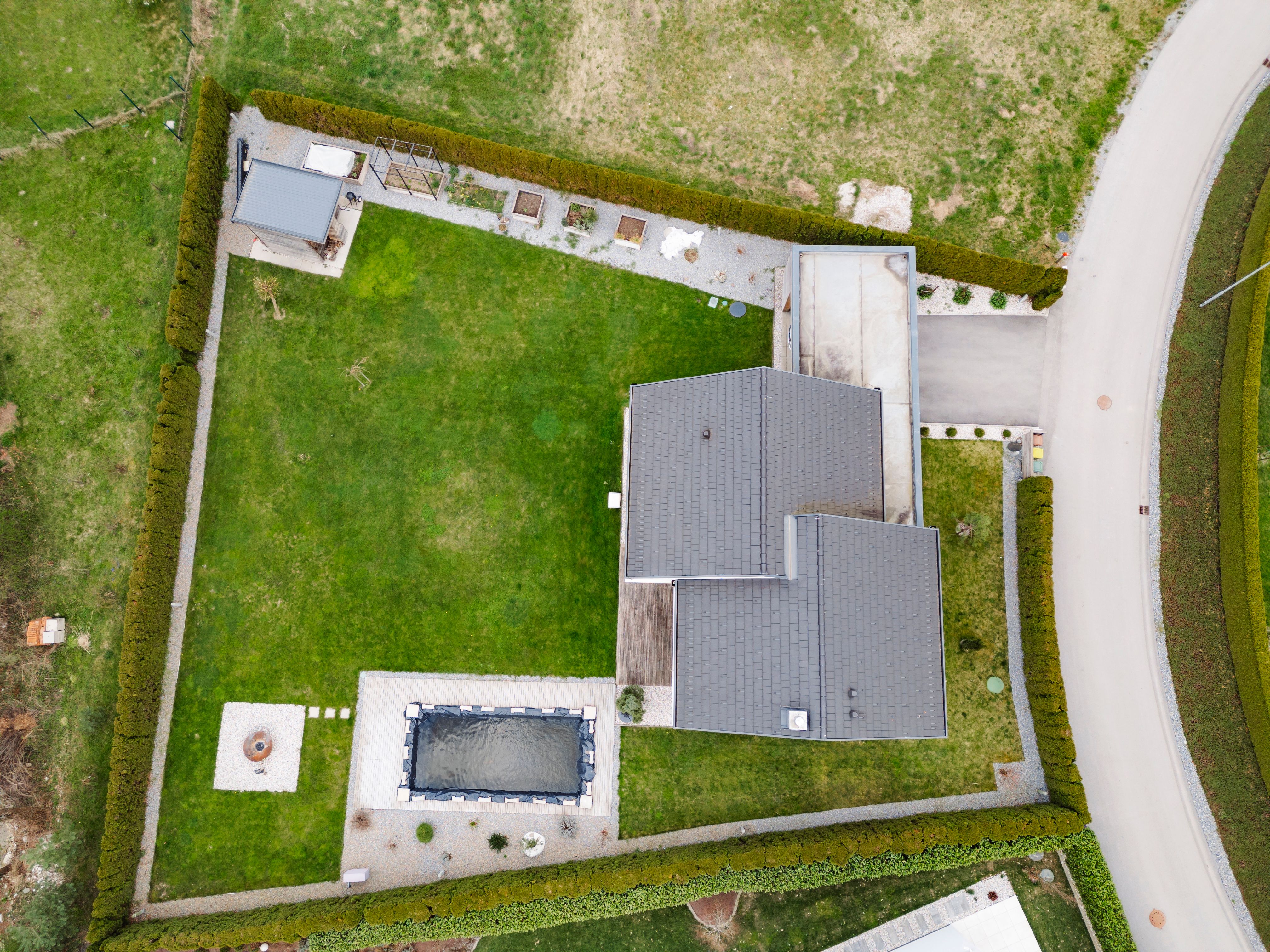 Aerial view of modern house with garden and pond Aerial view of modern house with garden and pond