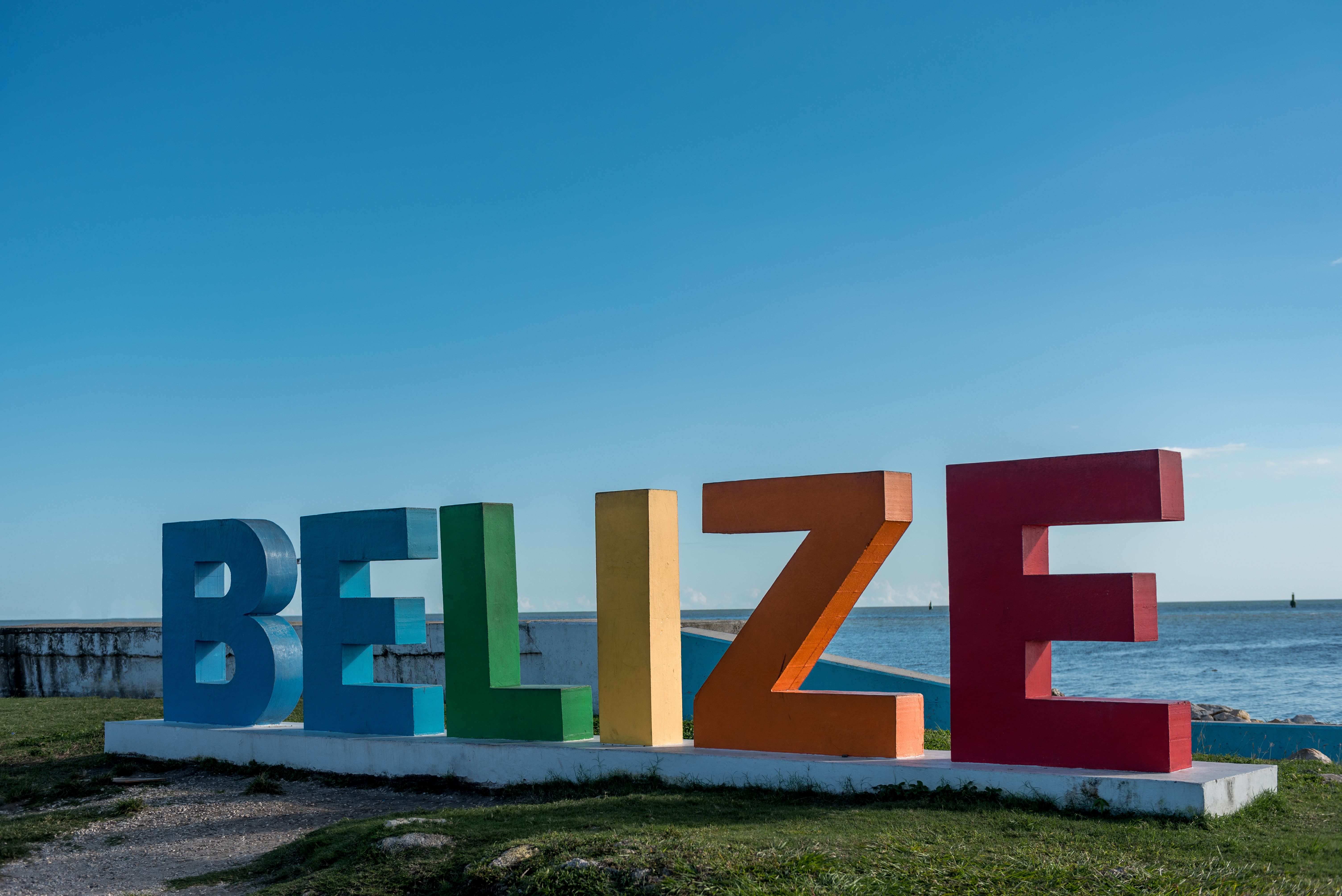 Colorful Belize name with Caribbean Sea in Background. Caribbean Island
