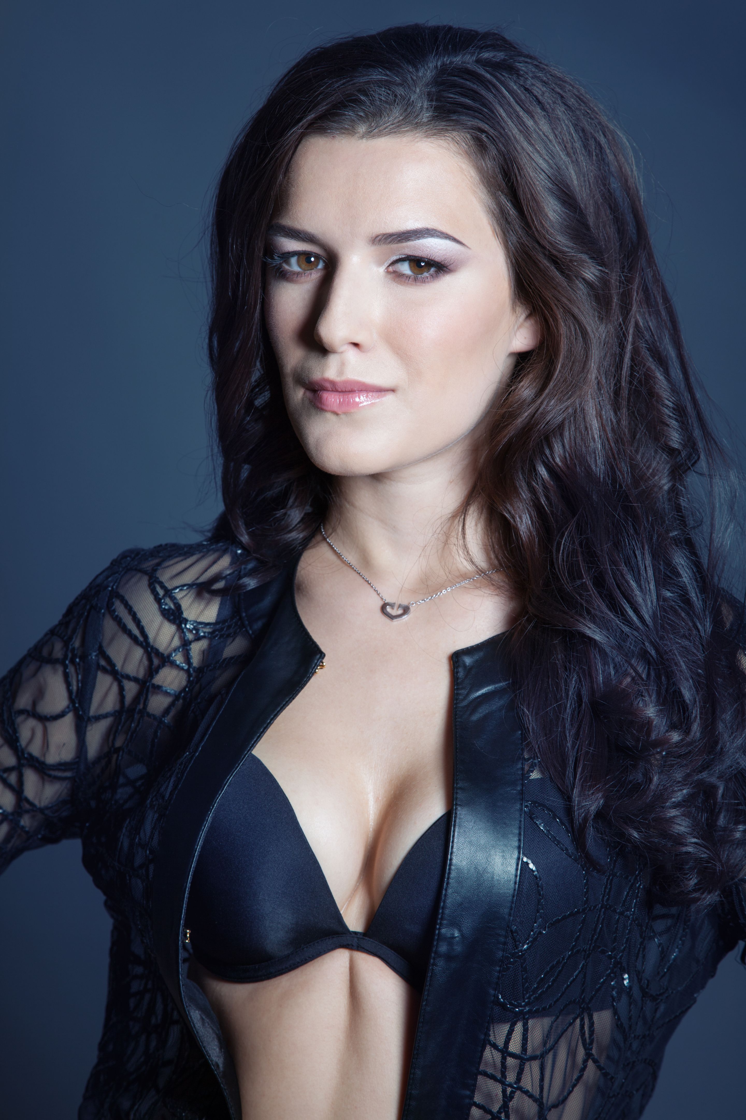 Brunette beautiful girl posing in black lingerie