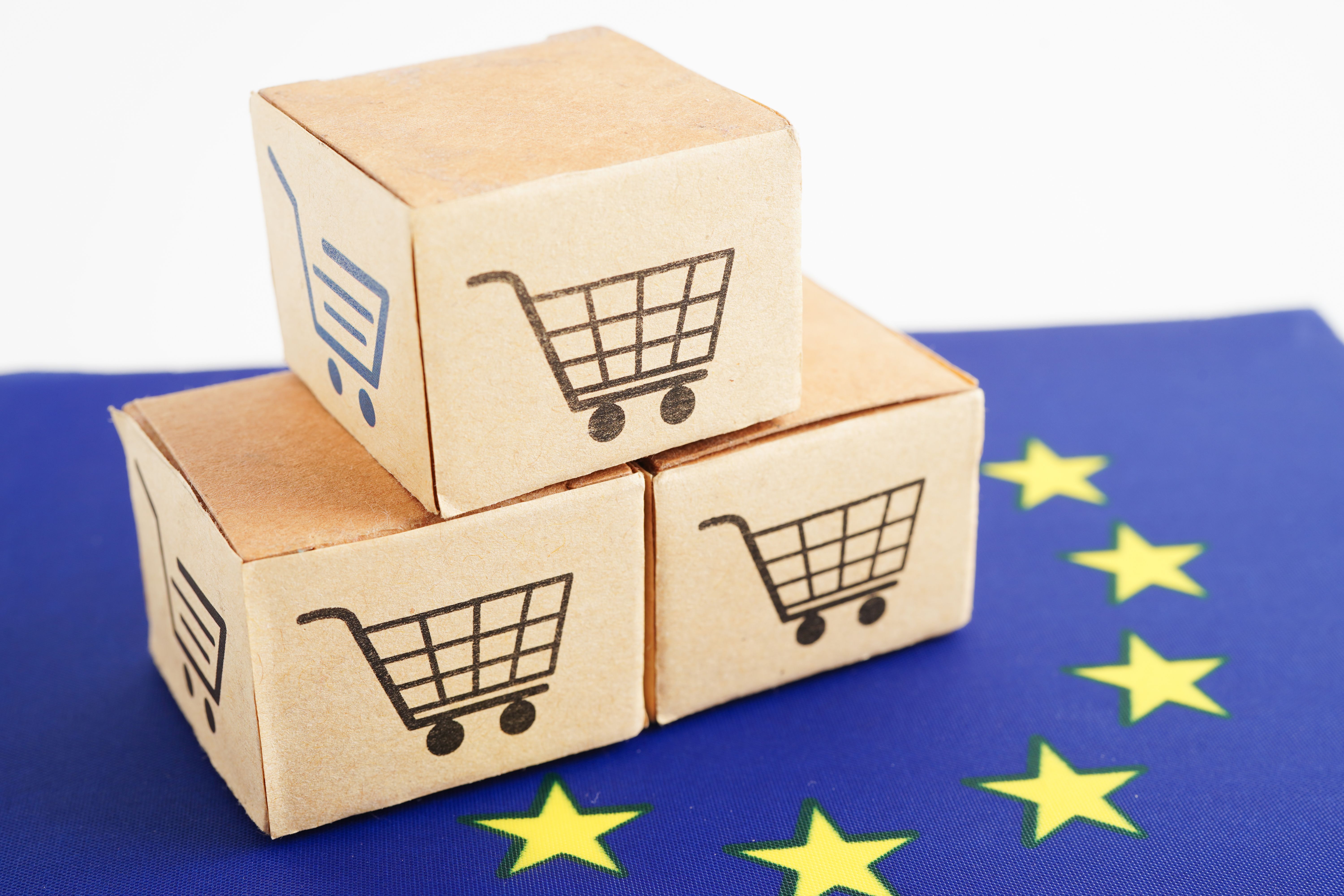 Online shopping, Shopping cart box on EU European Union flag, import export, finance commerce.