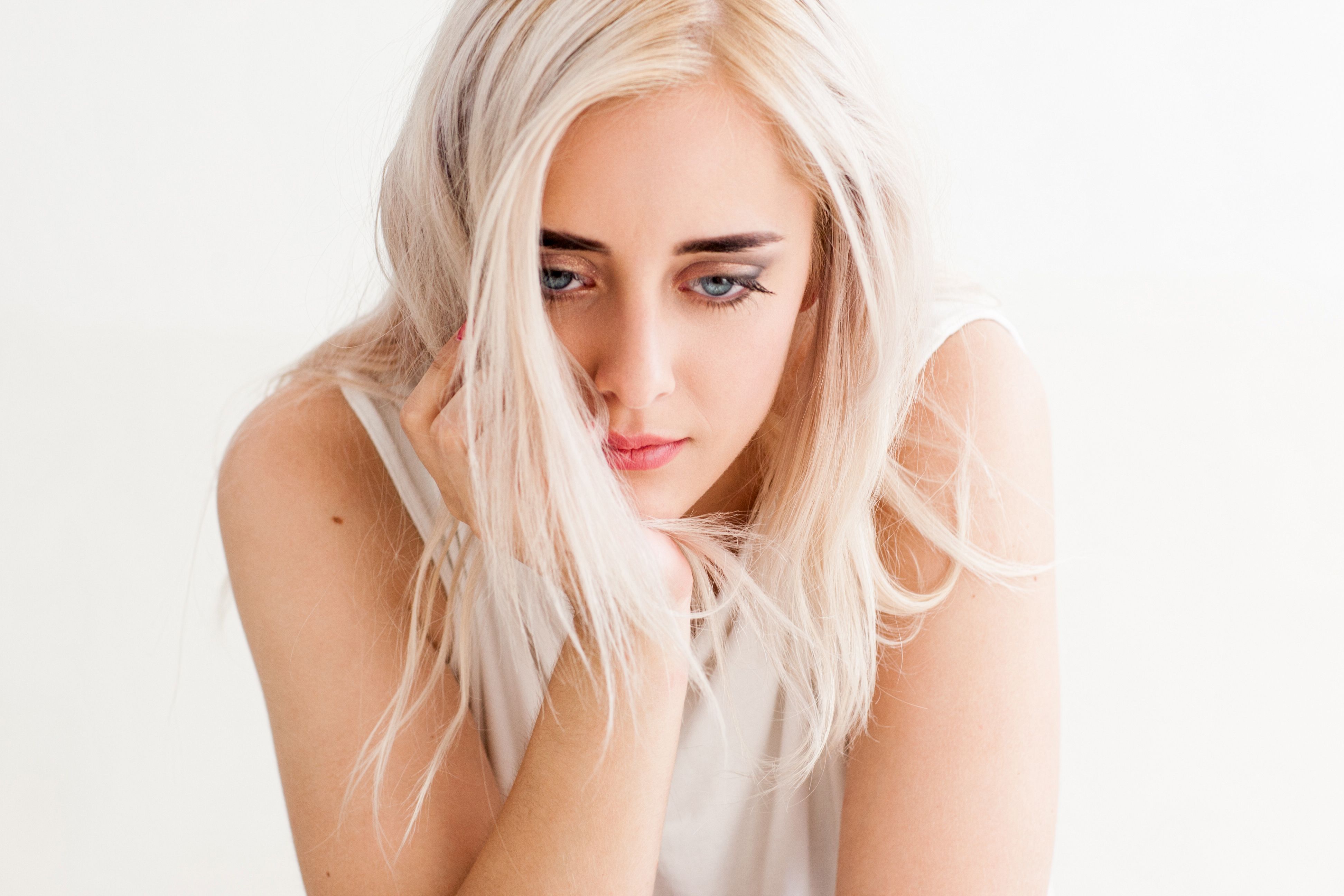 Sad  lonely woman looking down in disappointment