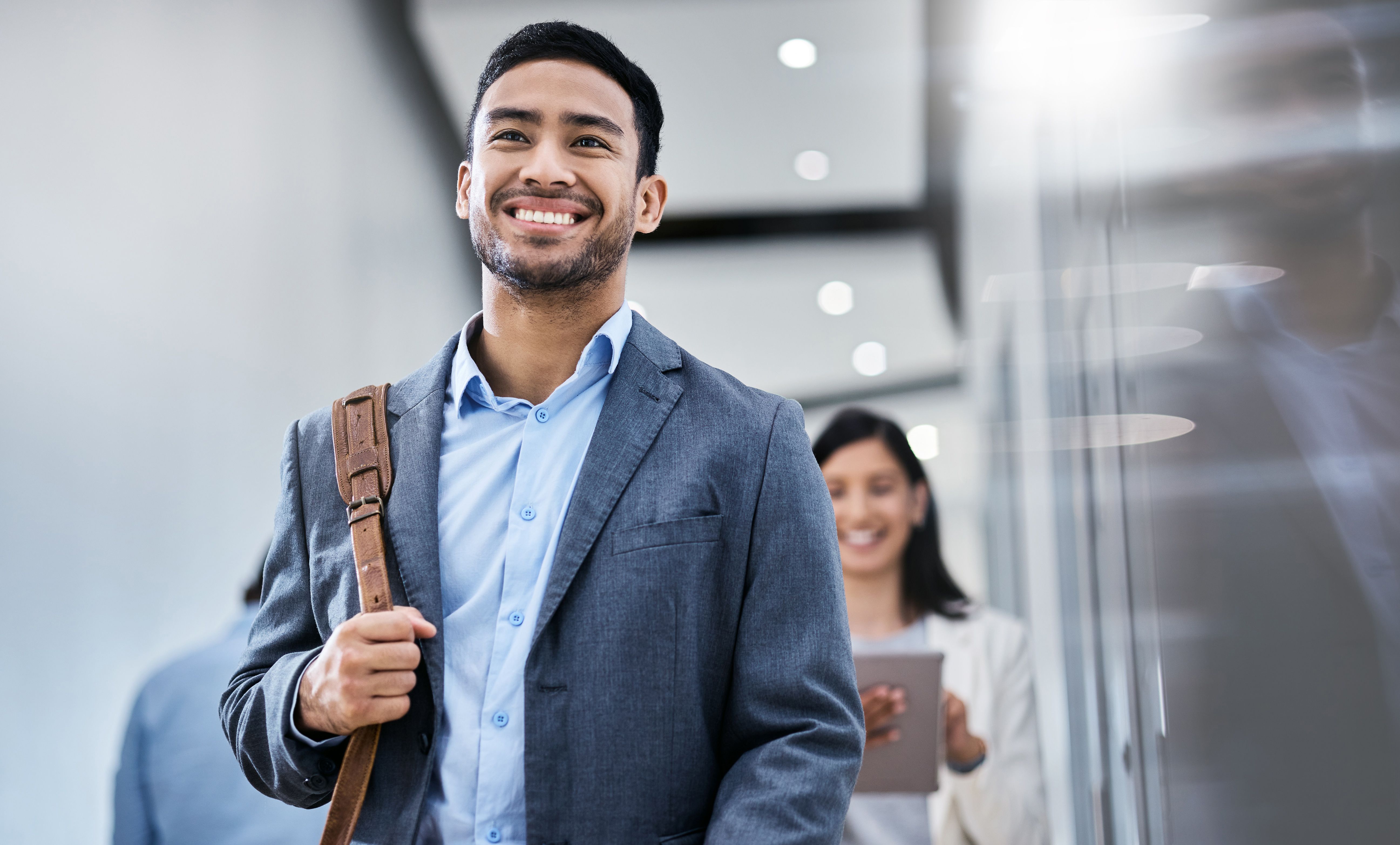 Shot of a business smiling while walking through the office Shot of a business smiling while walking through the office