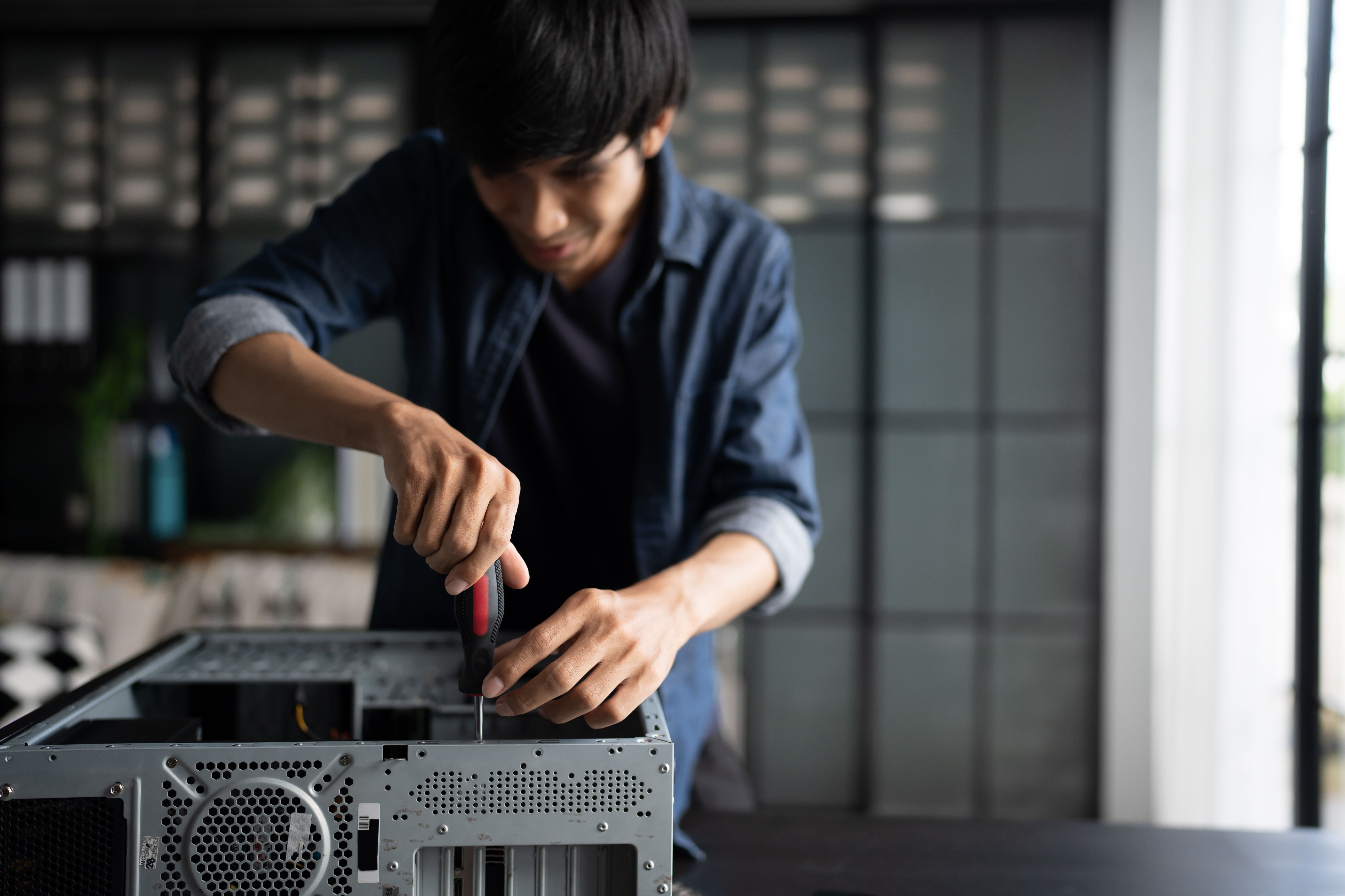technician repairing computer