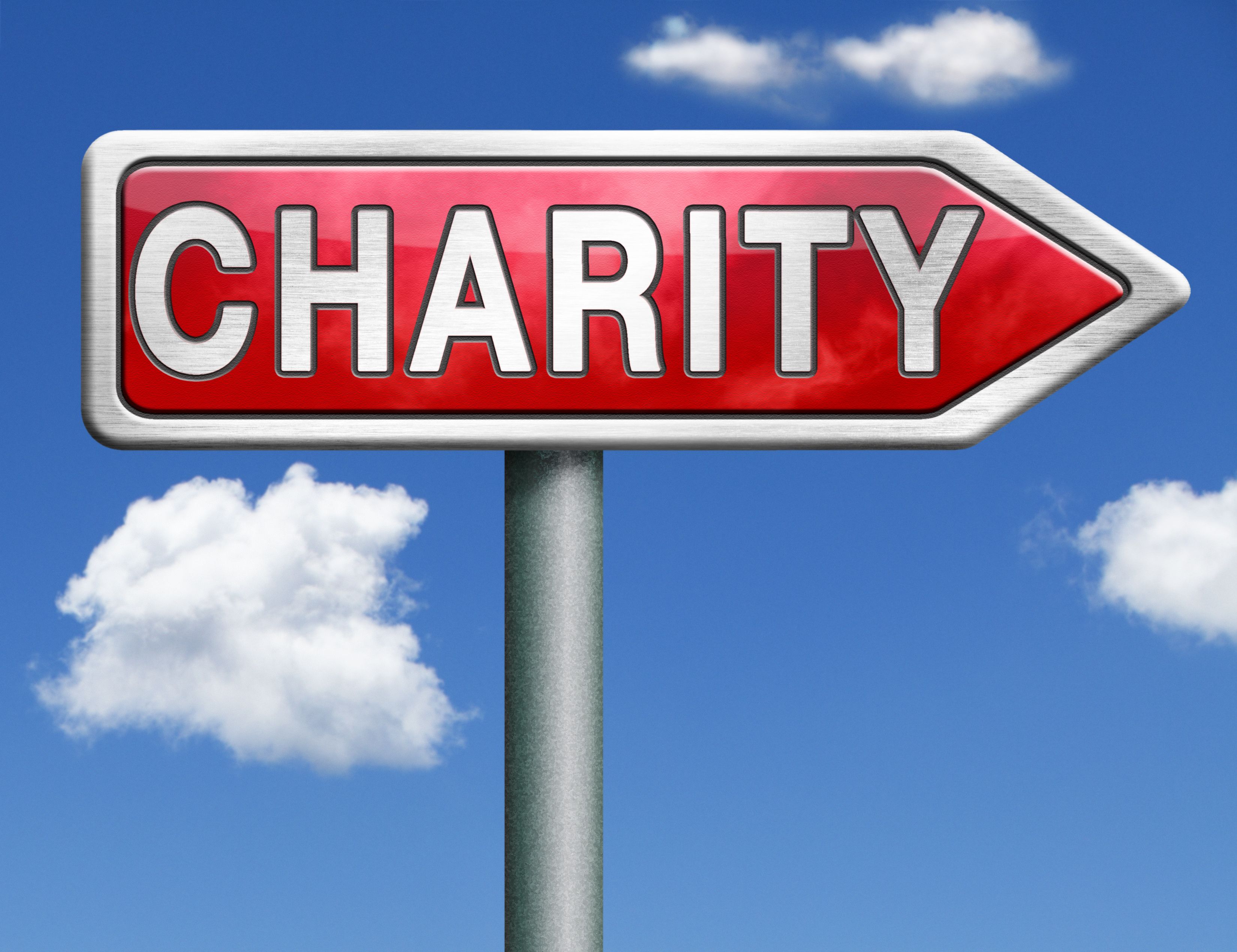 Directional sign labeled 'Charity' against a blue sky, representing nonprofit organizations navigating state registration requirements for compliance and donor trust.