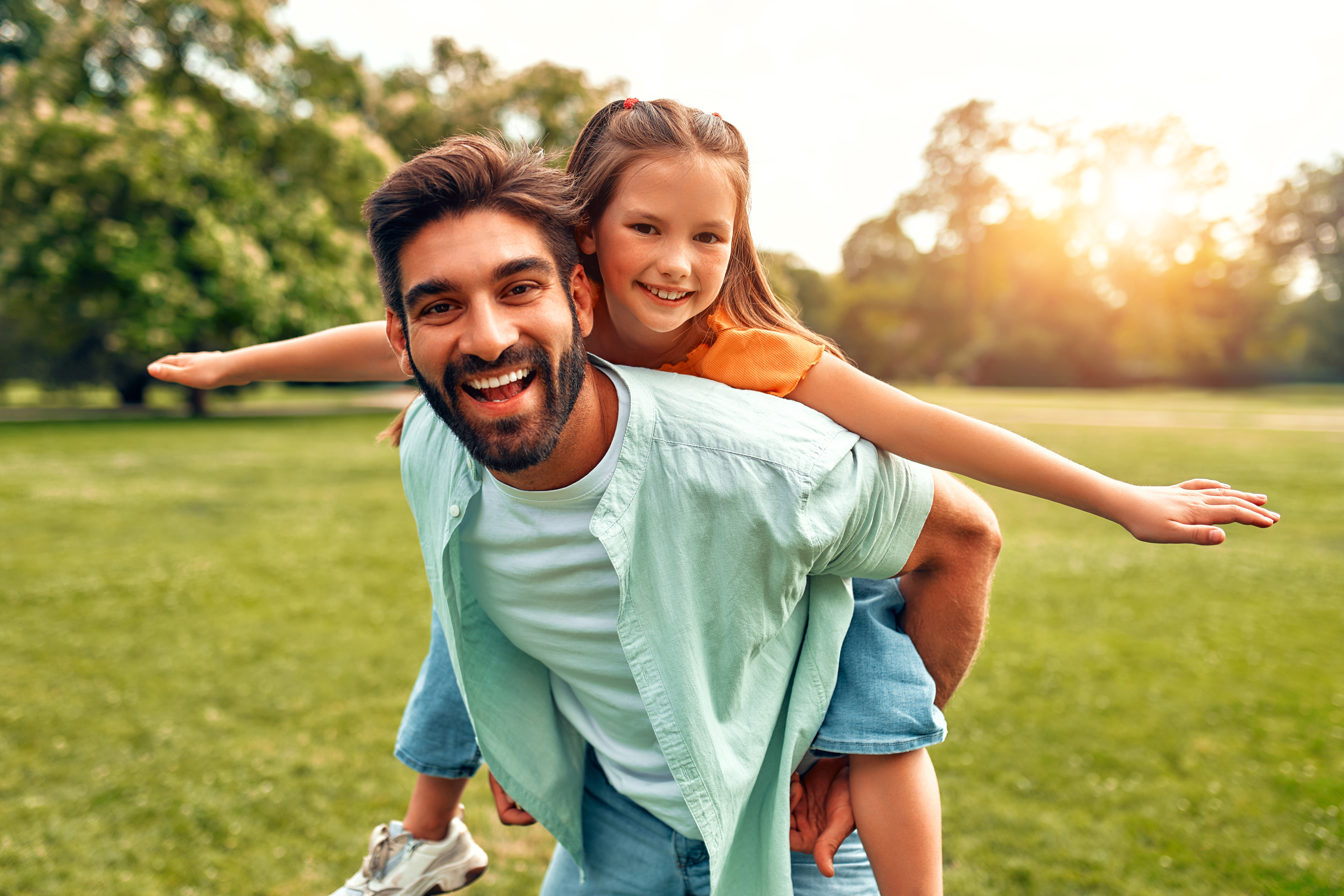Happy family relaxing in the park