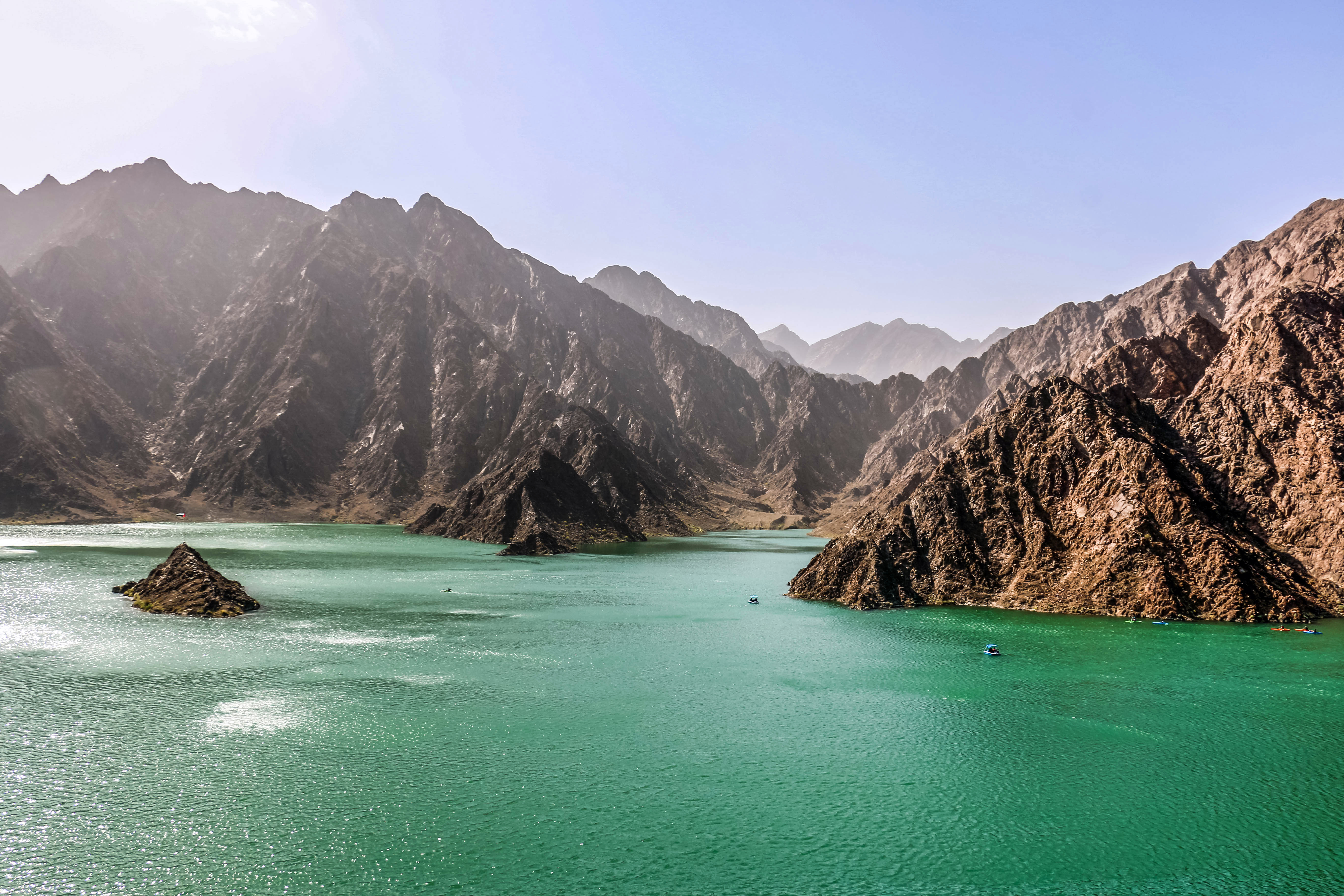Lake between mountains at Hatta Dam eastern region of Dubai, United Arab Emirates