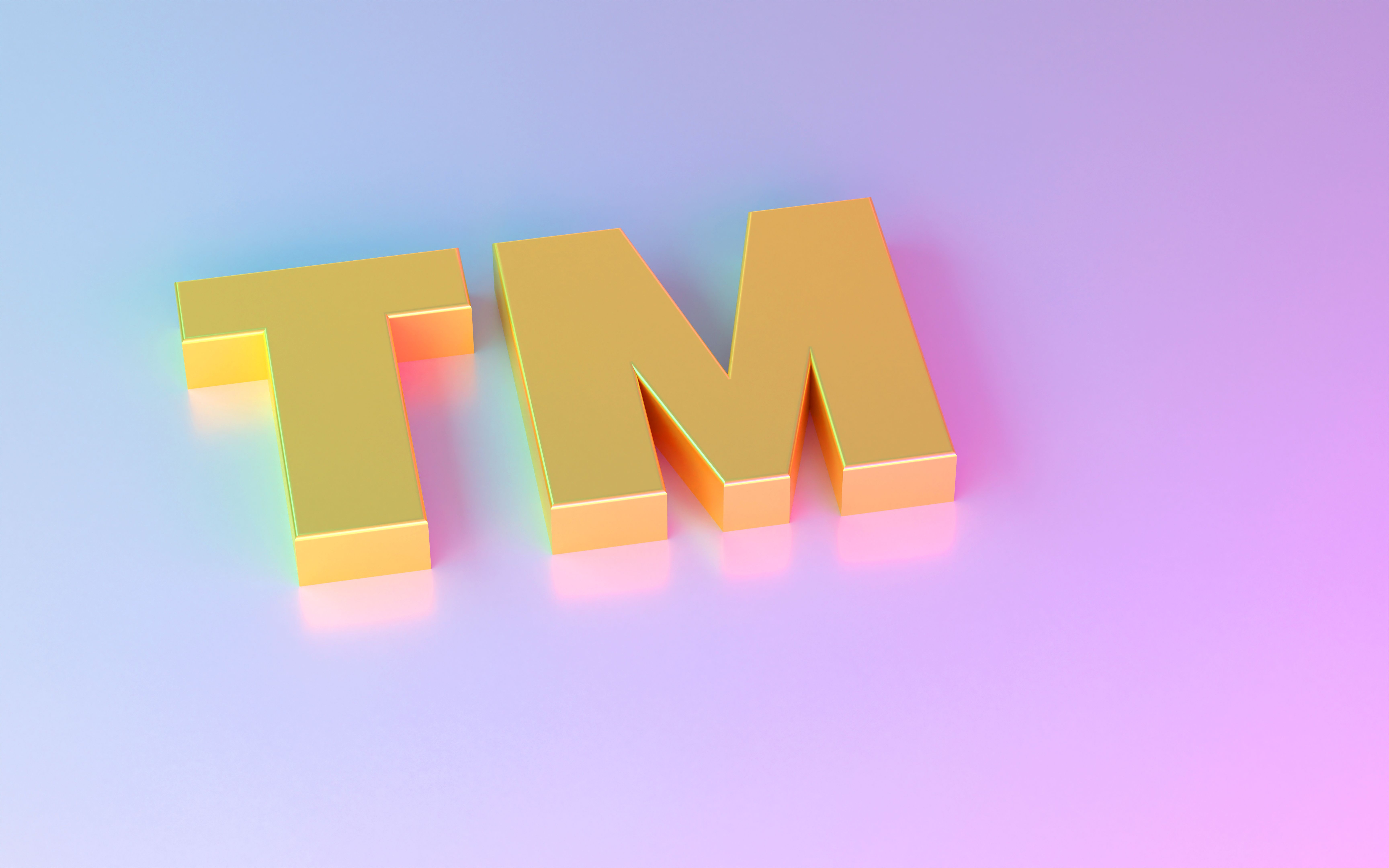 Gold colored Trademark Symbol on colorful background