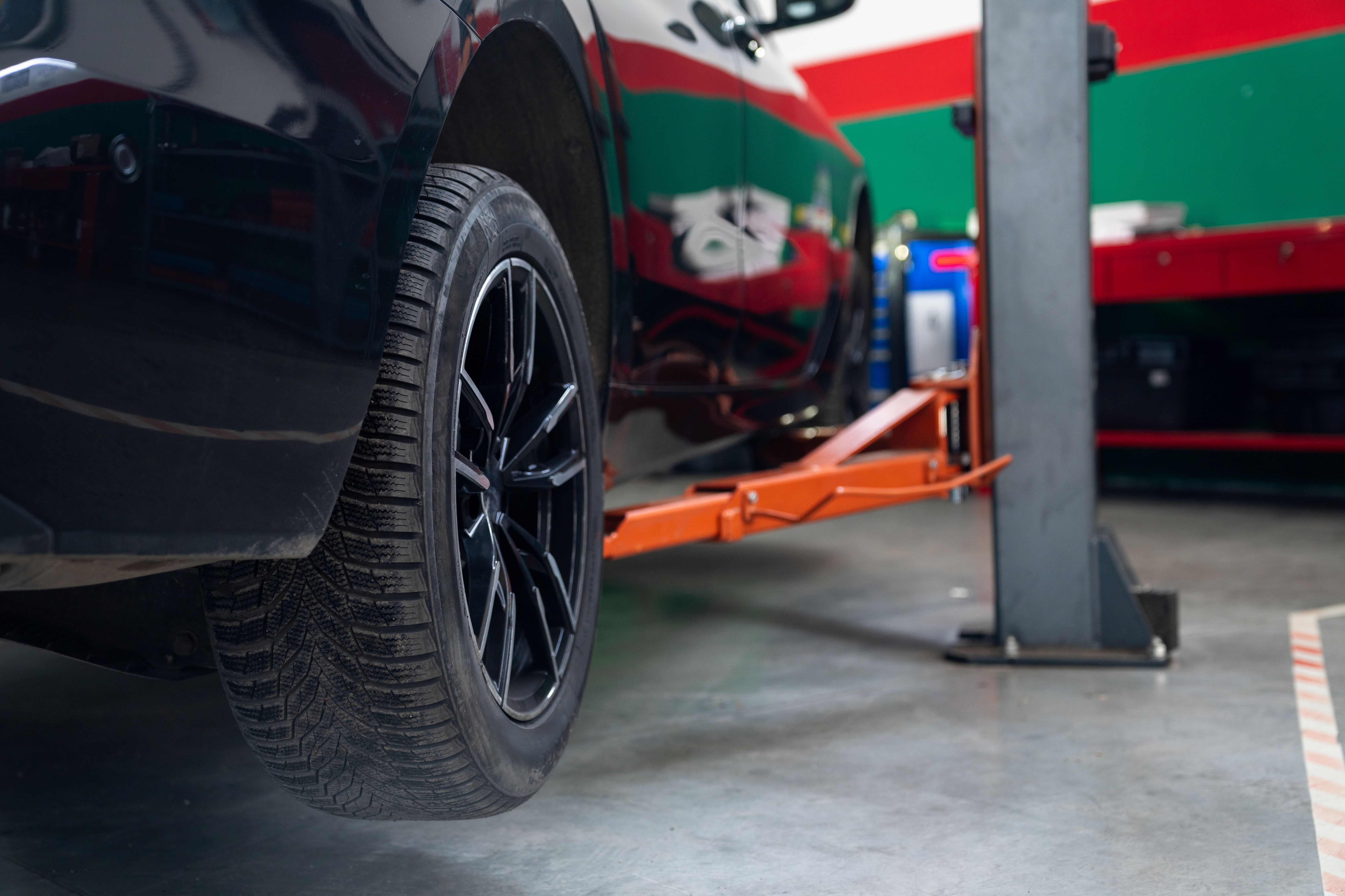 Car service workshop with cars on a column lifts. Car service workshop with cars on a column lifts.