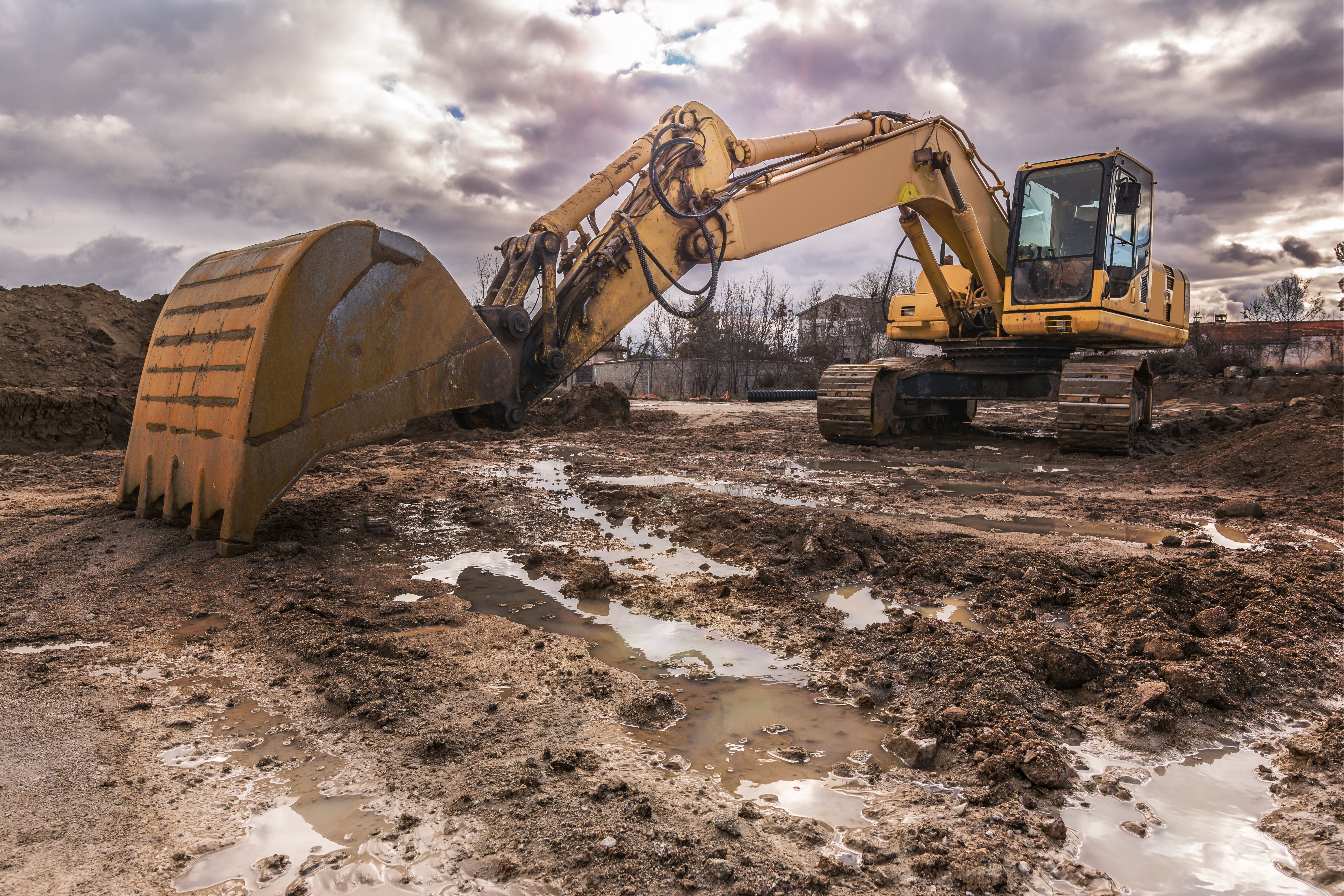 Excavator on a hard day of work on a construction site